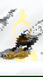 A French Louis XV style bronze mantle clock with elephant and winged putti by Fortin à Paris