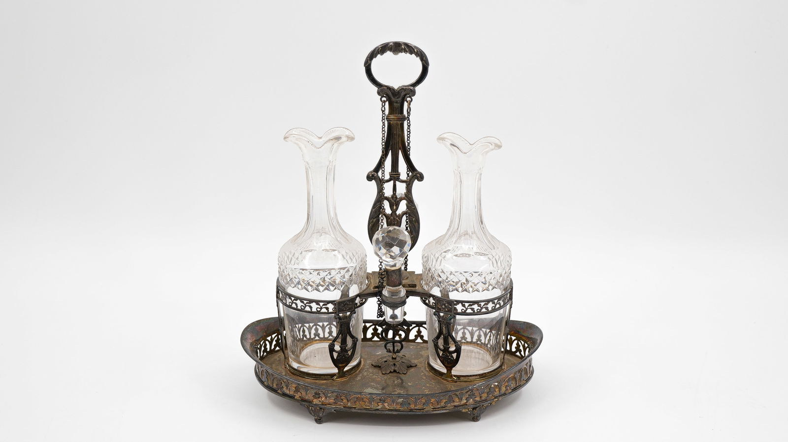 An antique decorated silver liqueur set with crystal-cut decanters (1 of 13)