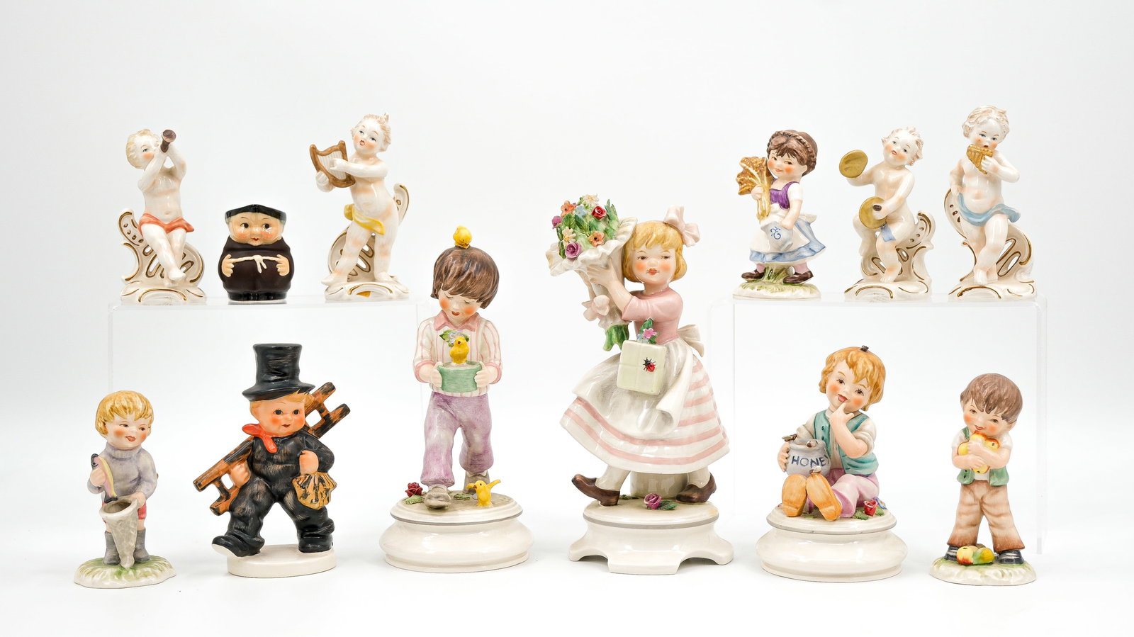 A collection of 12 various Goebel decorated ceramic figurines of children (1 of 18)