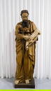 A monumental religious antique and patinated carved wood sculpture of Saint Paulus