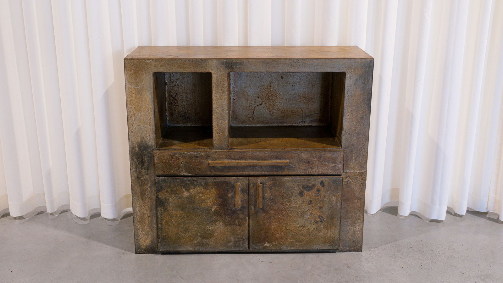 Pia MANU (XX) A patinated steel two-door cupboard with drawer: Pia MANU (XX). A patinated steel two-door cupboard with drawer. Circa 1980s. H: 91 × W: 106 × D: 39 cm