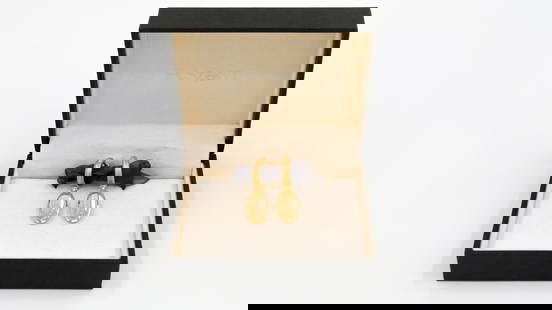 A pair of 18k gold and diamond earrings by H. STERN: A pair of 18k gold and diamond earrings by H. STERN. Each earring features an oval faceted quartz drop suspended from a gold hoop. Elegant minimalist design. Stamped H. STERN and 750. Presented in ori