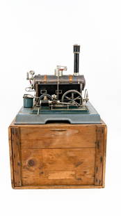 A vintage steam engine machine by MARKLIN Germany: A vintage old metal toy steam engine machine by MARKLIN Germany.In a protecting wooden box.Circa 1920's.H: 35 x W: 37 x D: 37 cm, machine