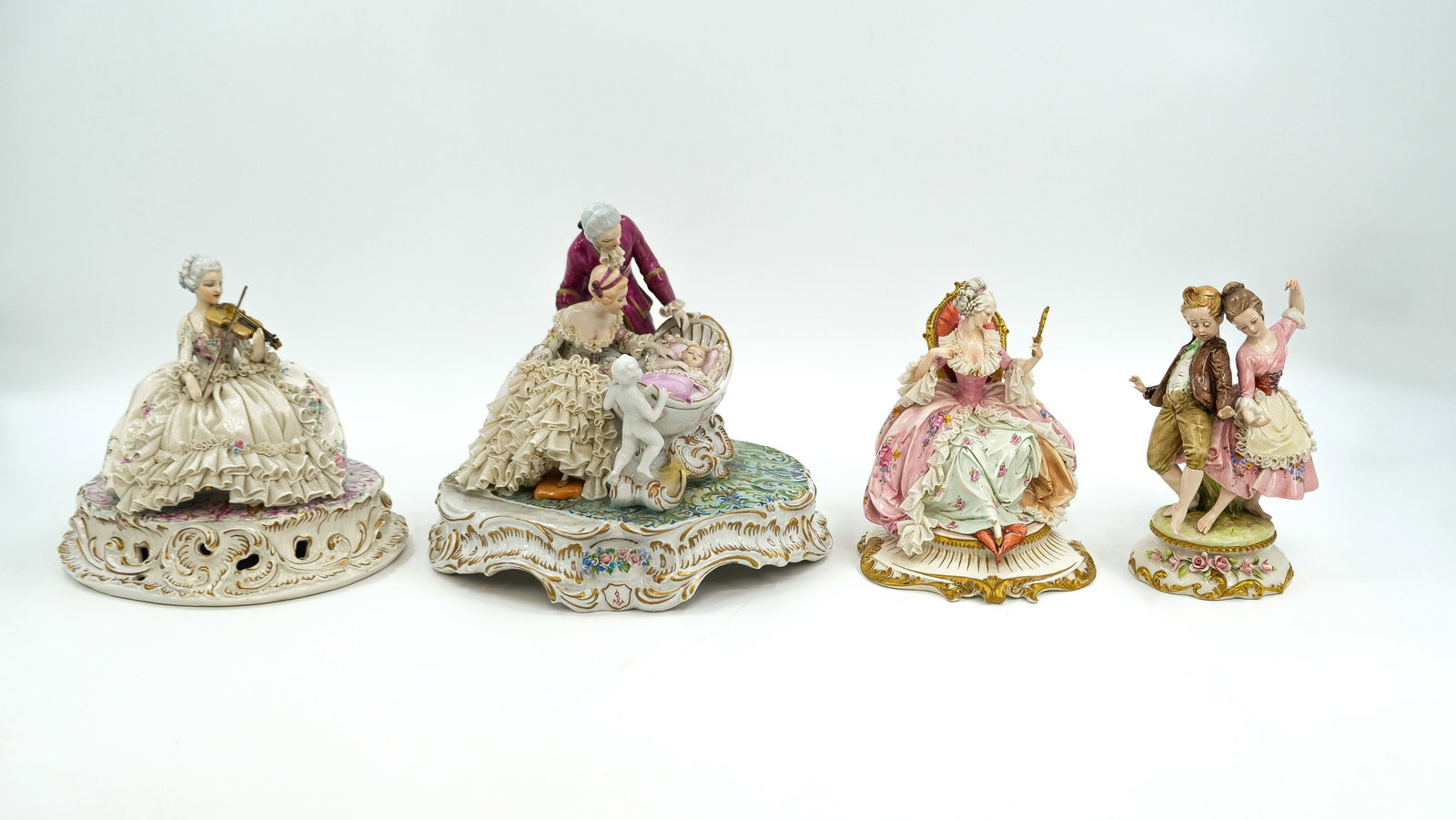 Luigi FABRIS (1919-1942) and Naples Capodimonte - A composed lot of four Italian porcelain groups: Luigi FABRIS (1919-1942) and Naples Capodimonte. A composed lot of four various Italian glazed porcelain and biscuit figural groups. Marked. Italy, 20th century. H: 20-25.5 cm