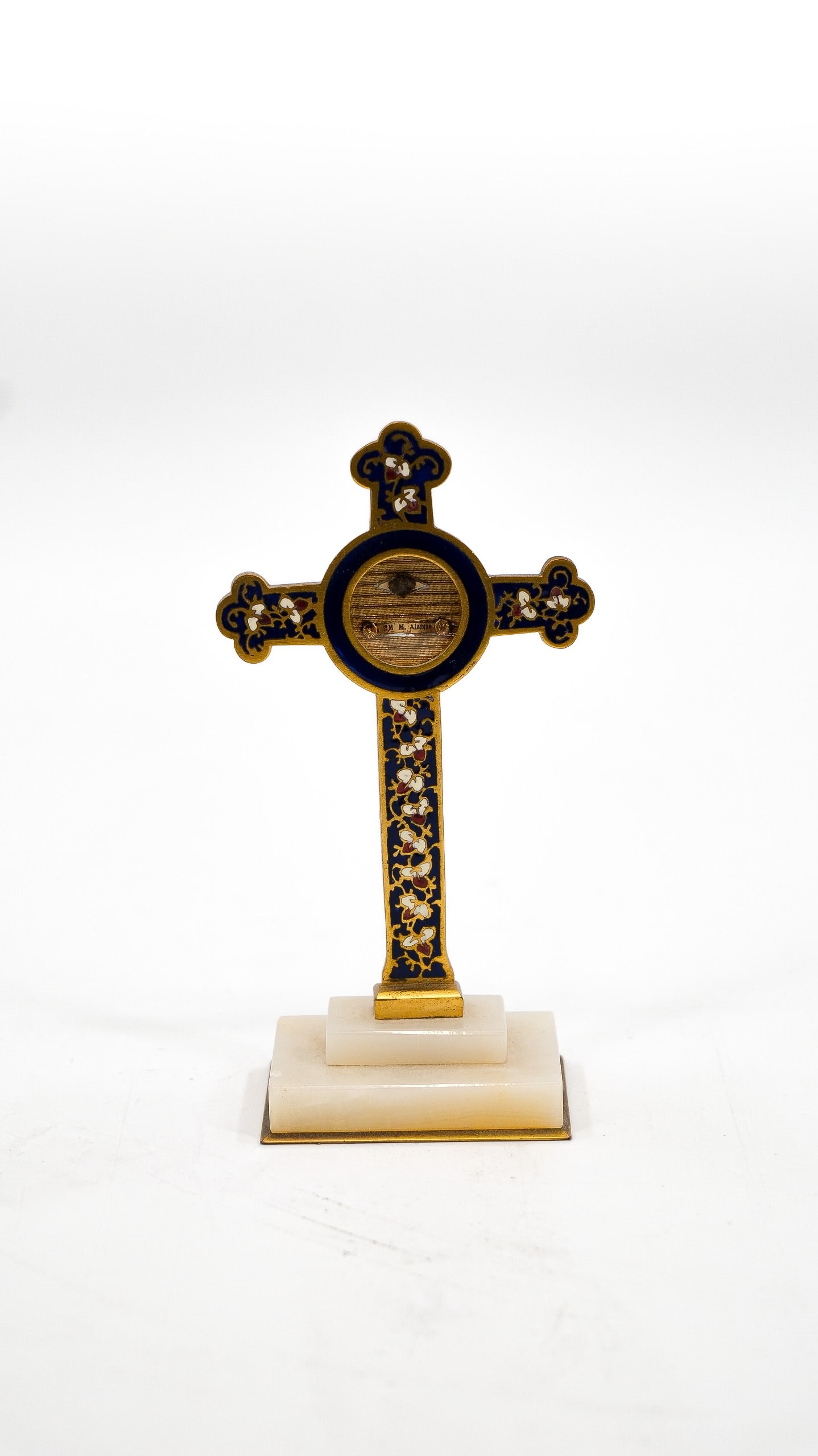 A religious gilt brass and champlevé enamel inlay cross with mounted sealed theca relic (1 of 9)