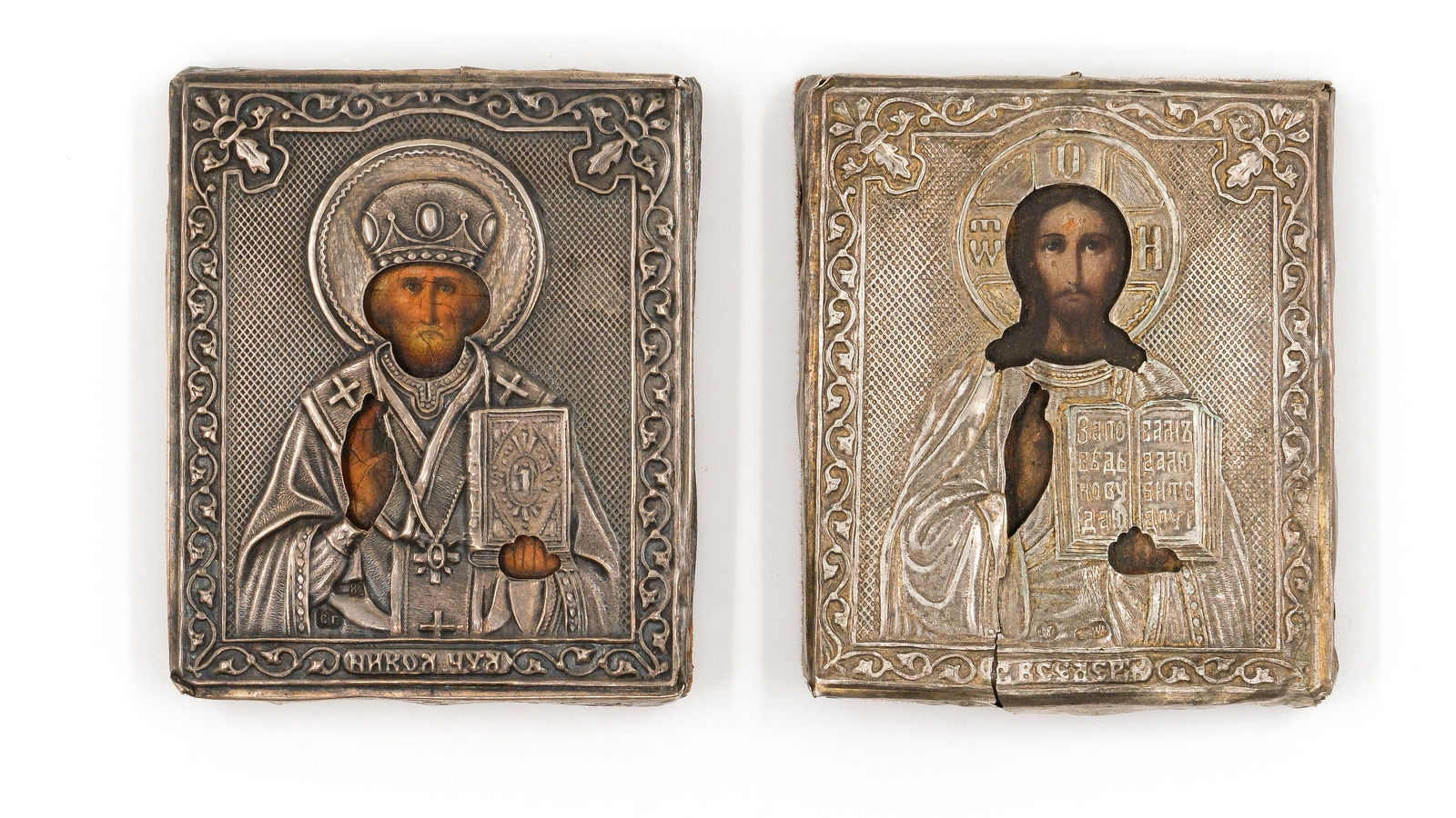 A lot of two antique Russian silver and tempera on wood icons Christ Pantocrator and Saint Nicholas (1 of 4)