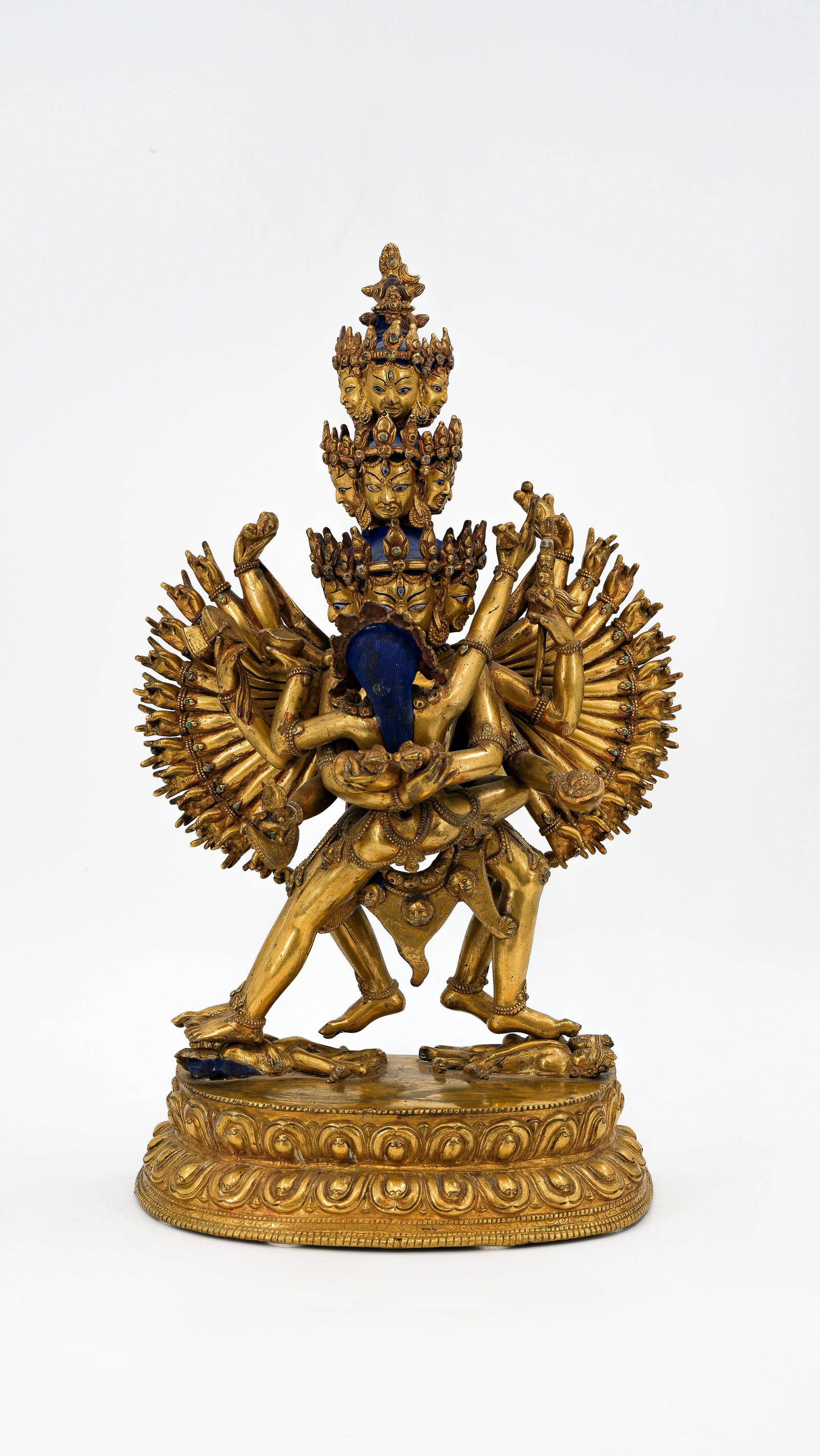 A large Tibetan or Nepalese gilt bronze multiple-armed figure of CHAKRASAMVARA and VAJRAVARAHI (1 of 13)