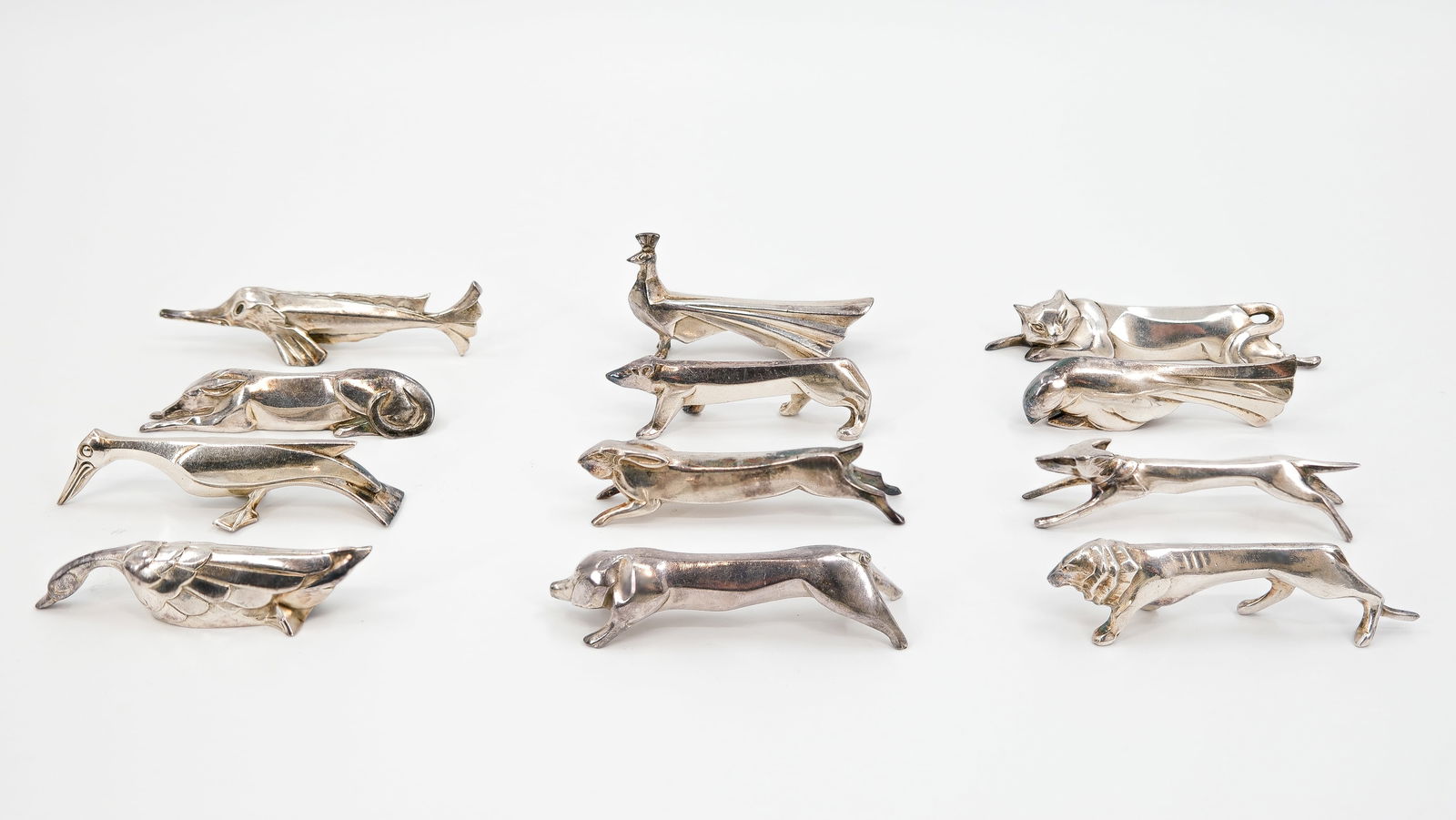A lot of twelve pieces silver-plated animal-shaped tableware cutlery coasters by O. GALLIA: A lot of twelve pieces silver-plated animal-shaped tableware cutlery coasters by Christofle, Gallia Collection, marked: O. GALLIA. 20th century. L: 8,2 - 11 cm, smallest to largest
