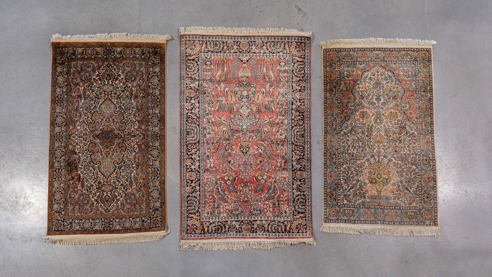 A composed lot of three fine hand-knotted Oriental wool and silk carpets (1 of 11)