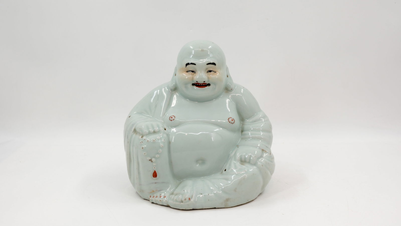 A Chinese blanc de chine porcelain figure of seated buddha