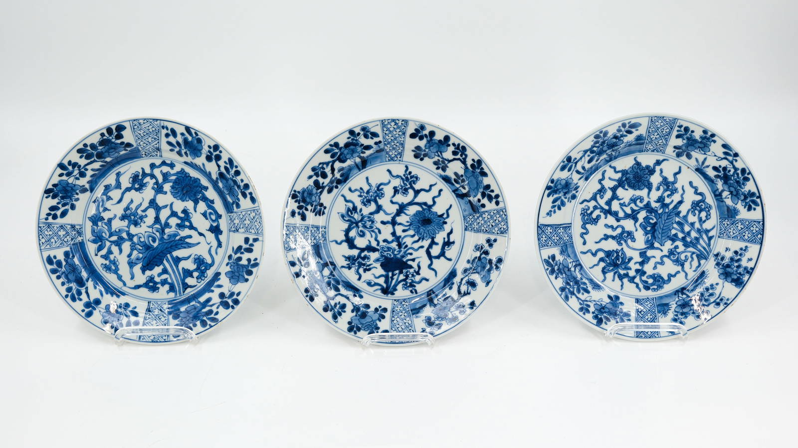 A lot of three Chinese Kangxi blue and white flora decorated plates