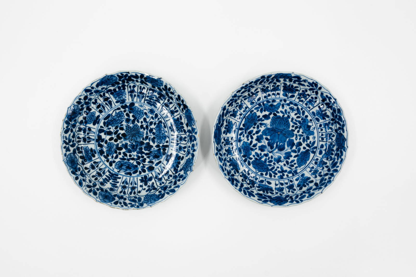 A lot of two matching Chinese blue and white flora decorated porcelain dishes