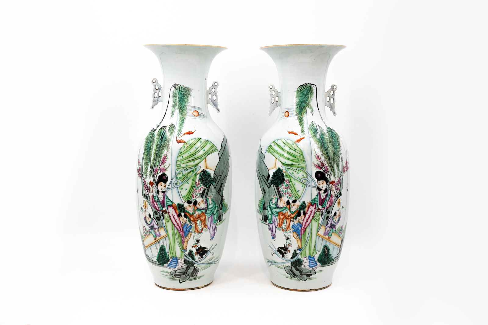 A pair of Chinese Famille Rose porcelain vases decorated with ladies and boys in the garden (1 of 13)