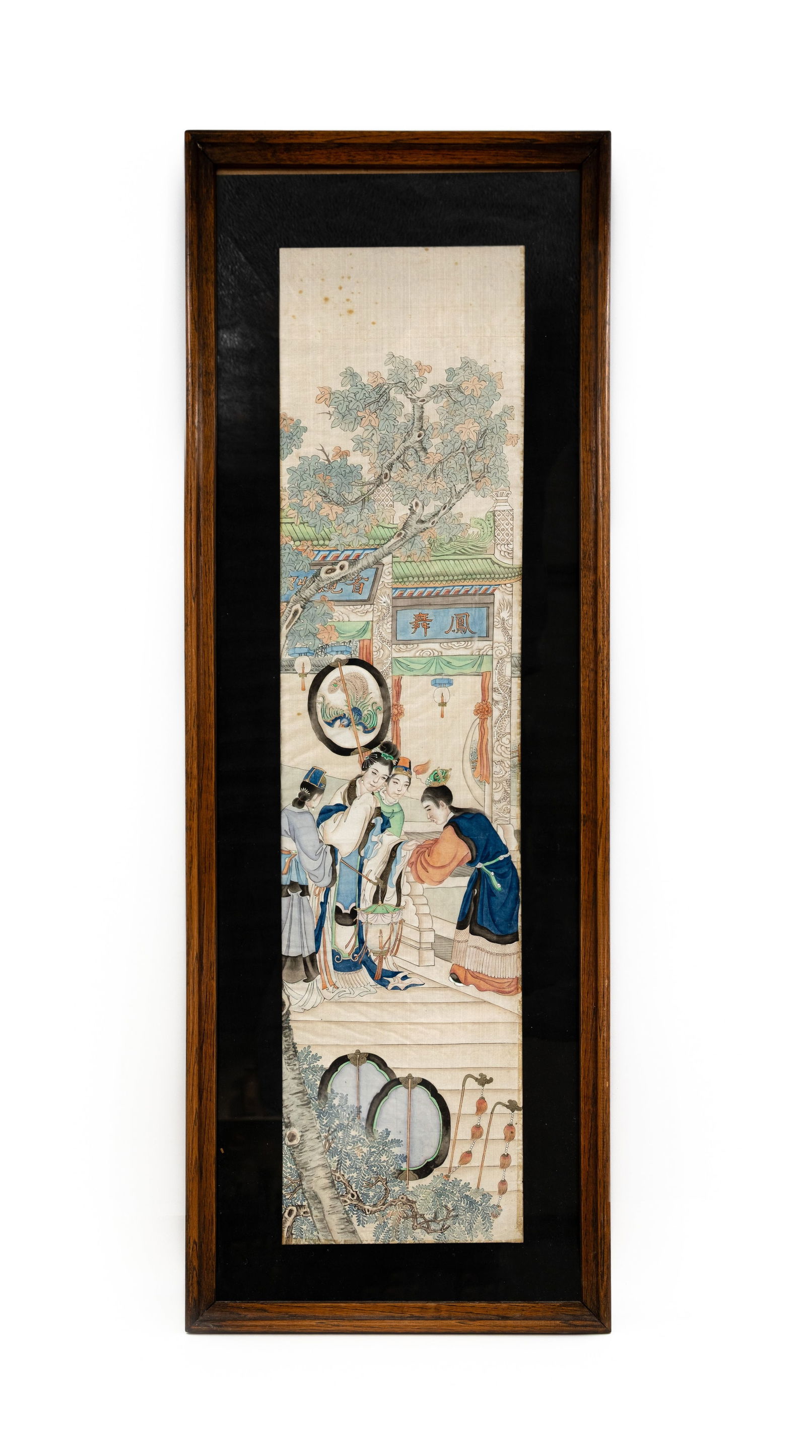 A Chinese rectangular shaped watercolor on silk painting: A Chinese rectangular shaped watercolor on silk painting depicting a figural palace scene in the garden. Glass protected and framed. 20th century. H: 80 - W: 20 cm