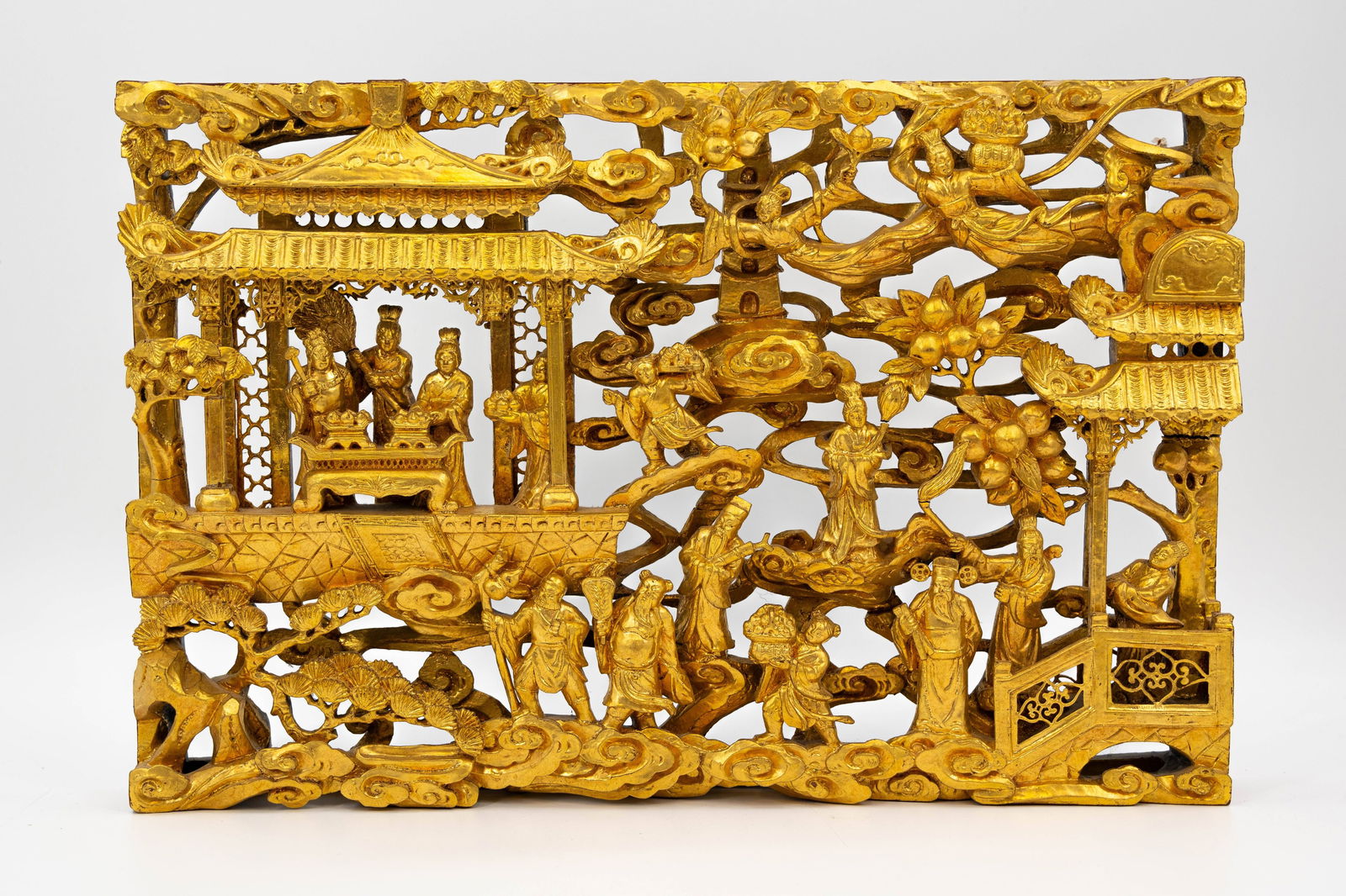 A Chinese gilt carved wooden wall plaque decorated with relief figures in a palace scene (1 of 9)