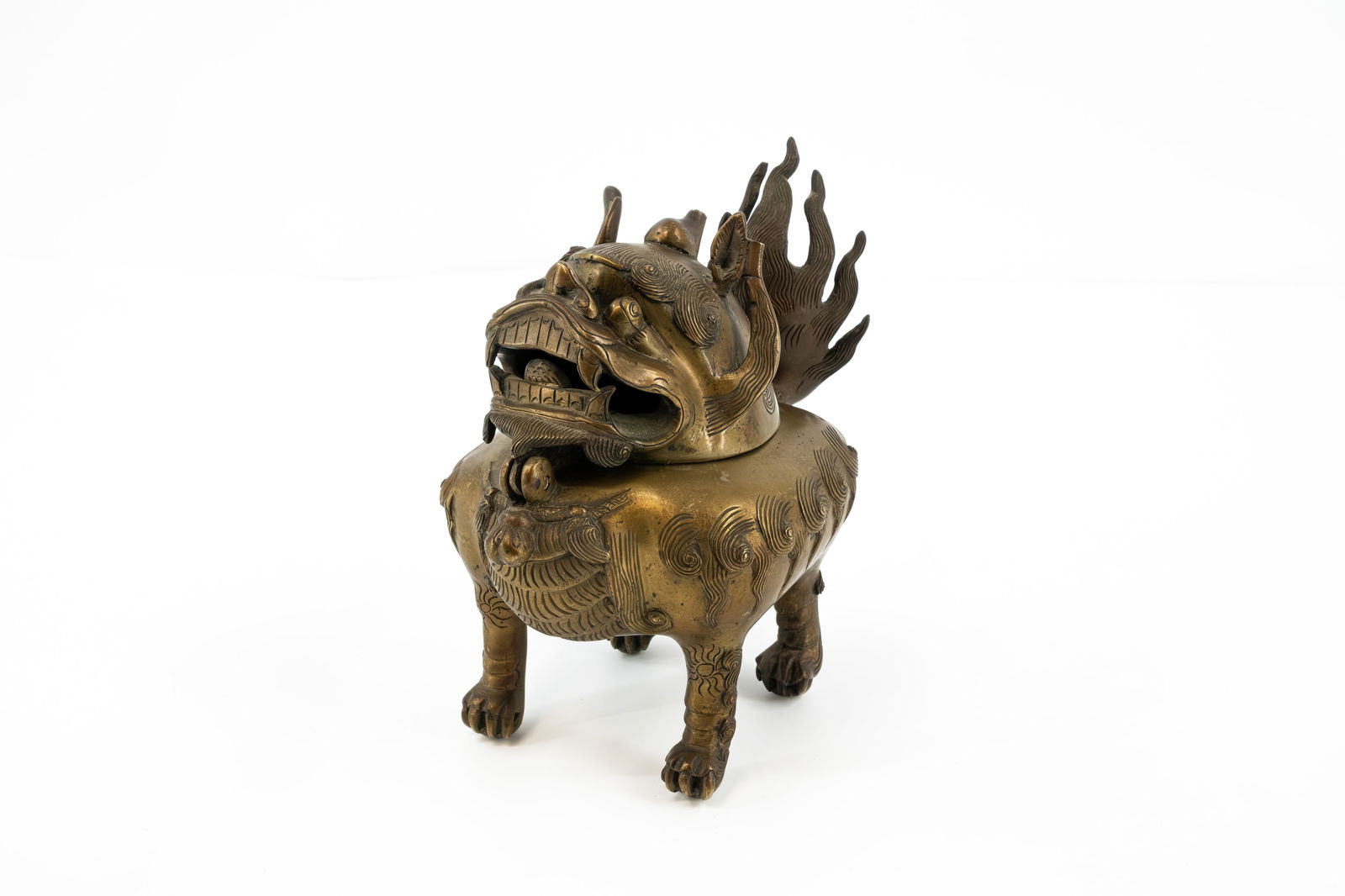 A patinated bronze Chinese covered incense burner in the shape of a Fu temple lion (1 of 13)