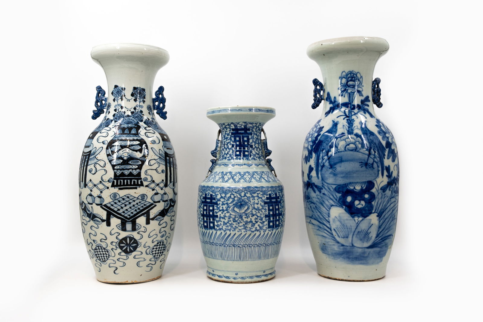 A lot of three Chinese blue and white variously decorated porcelain vases: A lot of three Chinese blue and white variously decorated porcelain vases. 19th/20th century. H: 42,5 - 57 - 58,5 cm