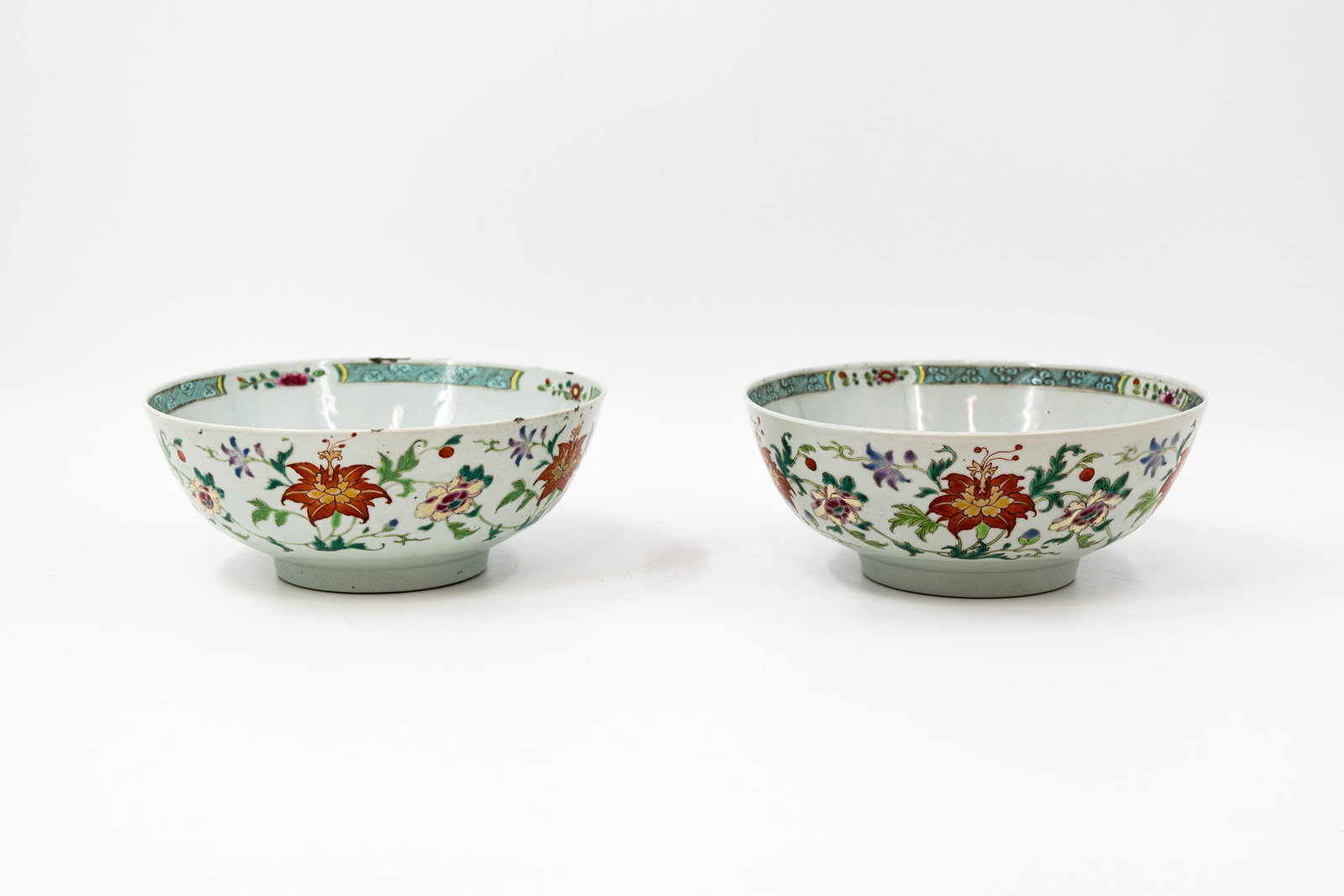 A pair of Chinese Famille rose lotus scroll decorated porcelain bowls (1 of 5)