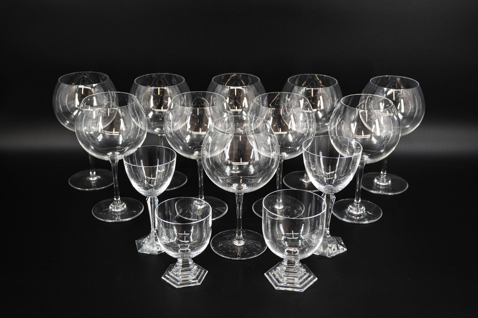 A composed lot of 14 glasses in baccarat crystal: A composed lot of 14 glasses in French Baccarat crystal, various models. All marked Baccarat. Consisting of: - 10 Romannee Conti degustation glasses - 1 small and 1 large Orsay glass - 1 small and