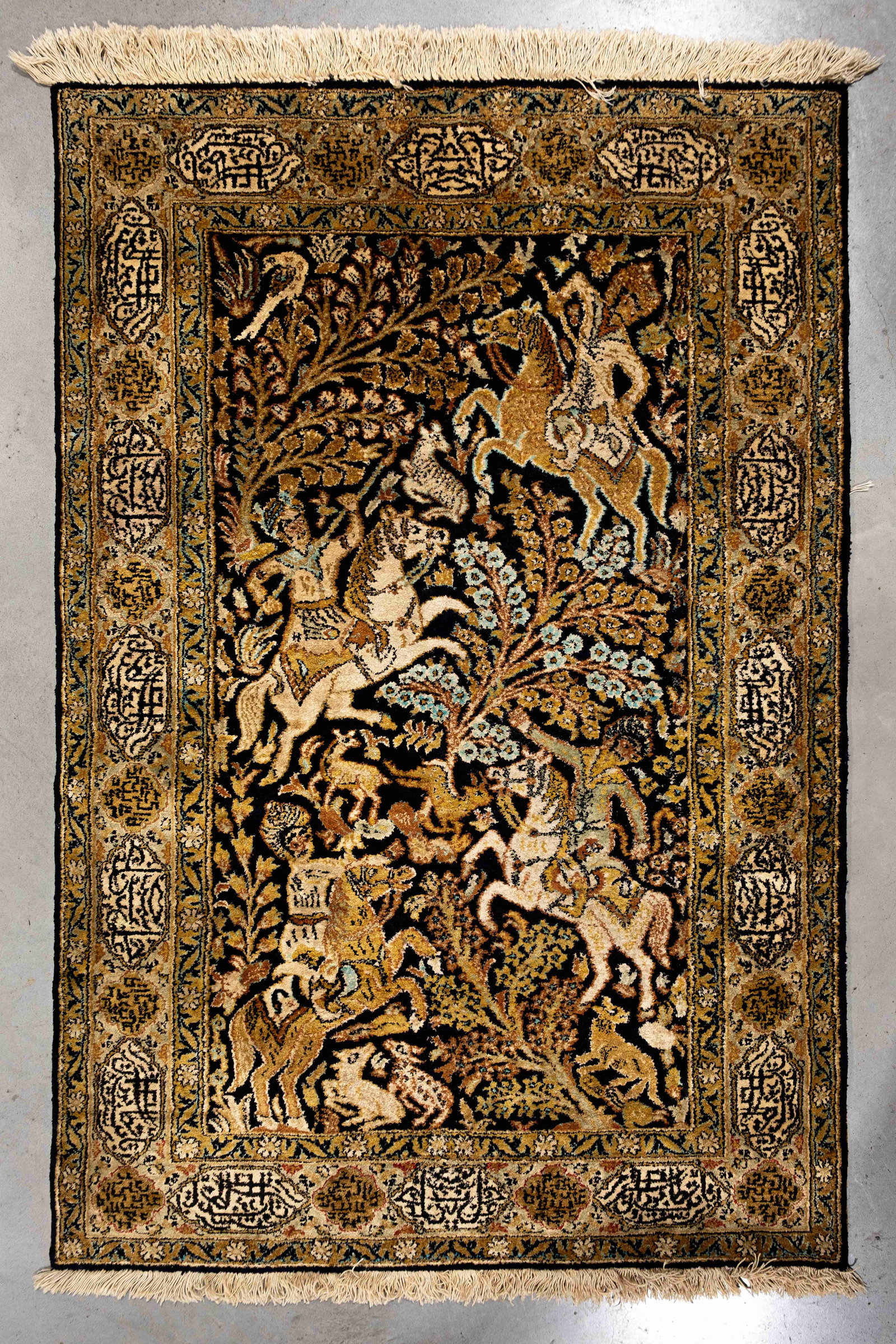 A Persian Ghom silk pictorial rug with a hunting scene (1 of 4)