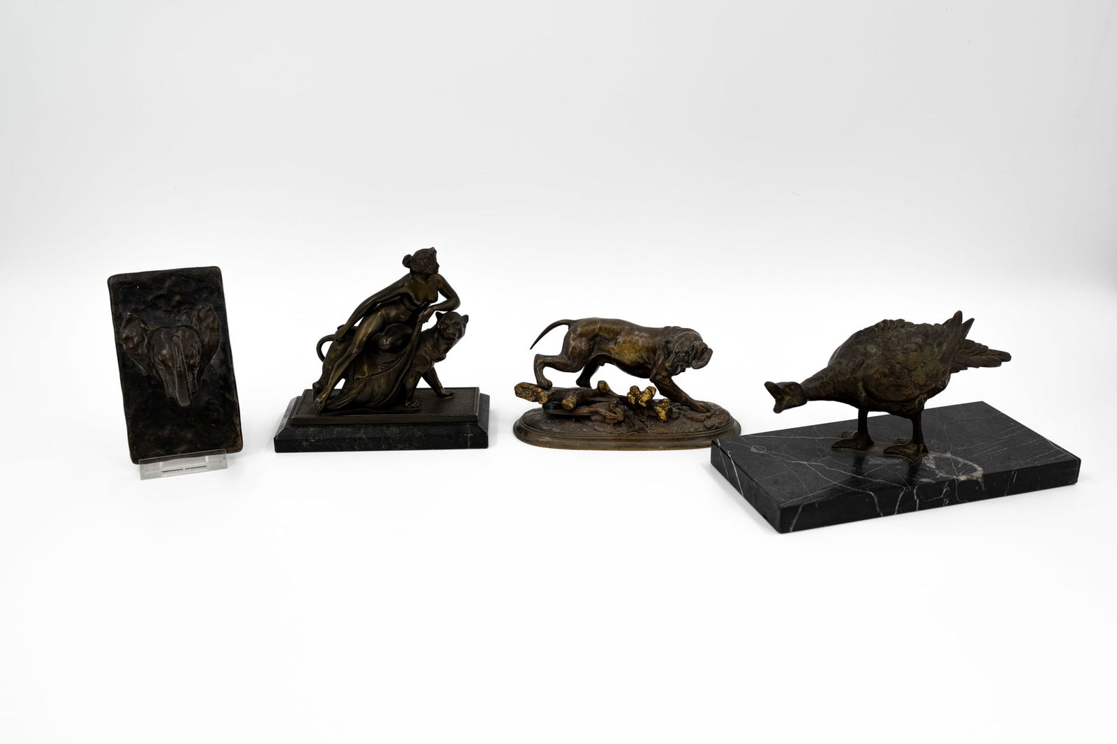 A lot of four antique patinated various bronze and spelter figurines (1 of 11)
