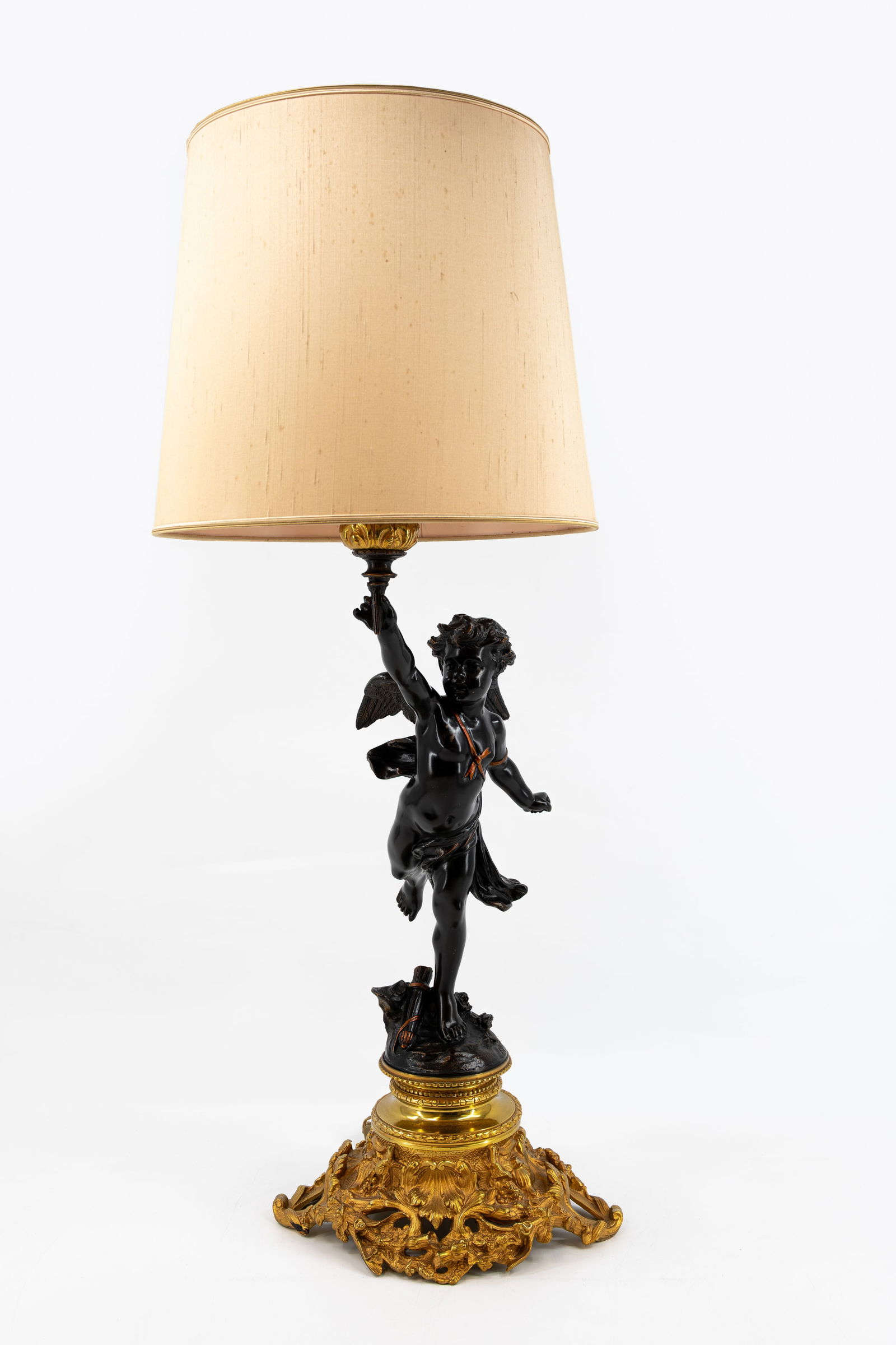 Jean-Louis GREGOIRE (1840-1890) A large and antique patinated gilt bronze figural candelabra lamp: Jean-Louis GREGOIRE (1840-1890) A large and antique patinated and gilt bronze candelabra lamp mounted with a standing winged putti. Signed, L.Gregoire and late 19th century. H: 100 cm, total