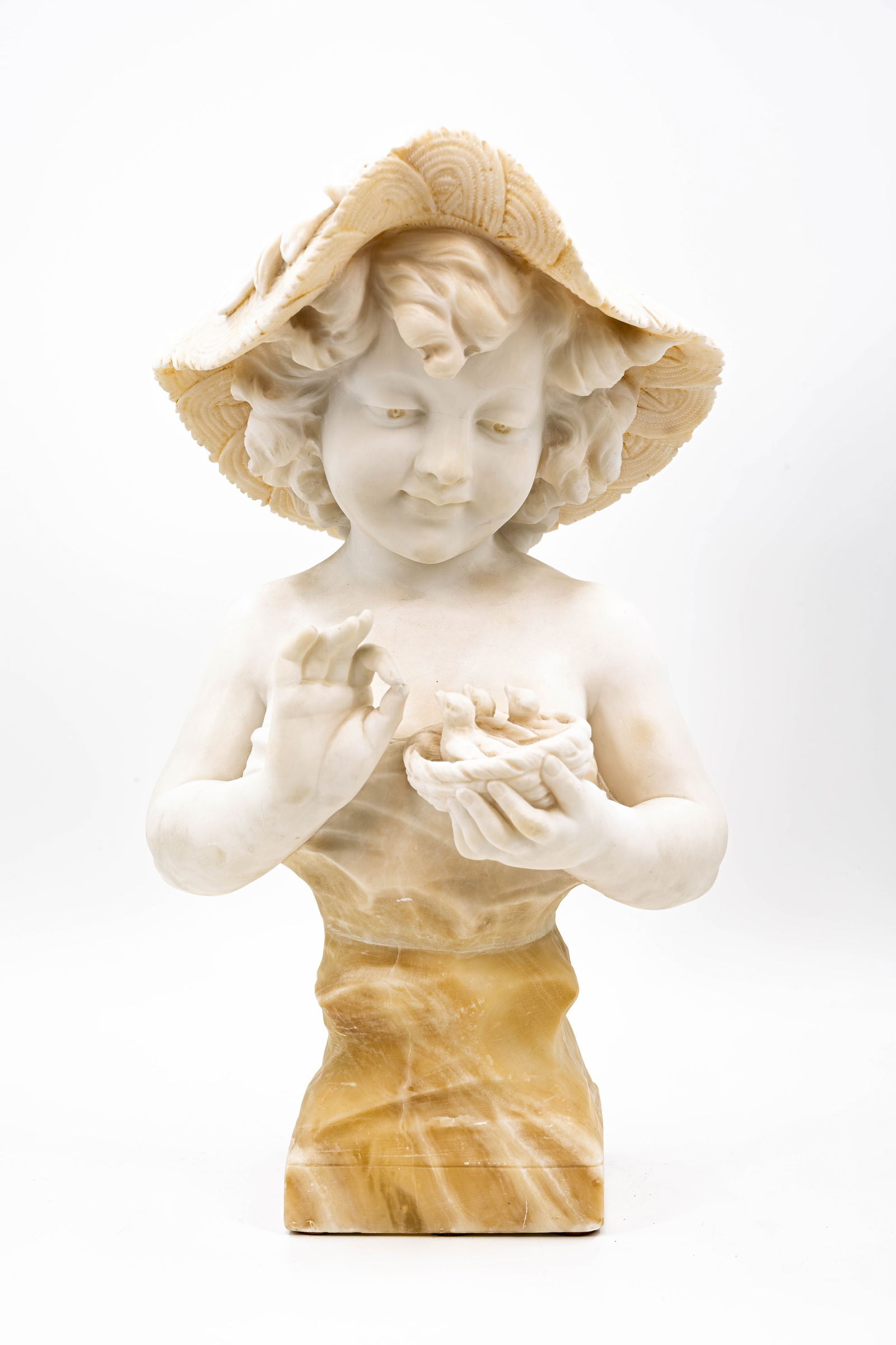 An antique carved alabaster marble sculpture of a child feeding the bird chicks (1 of 10)