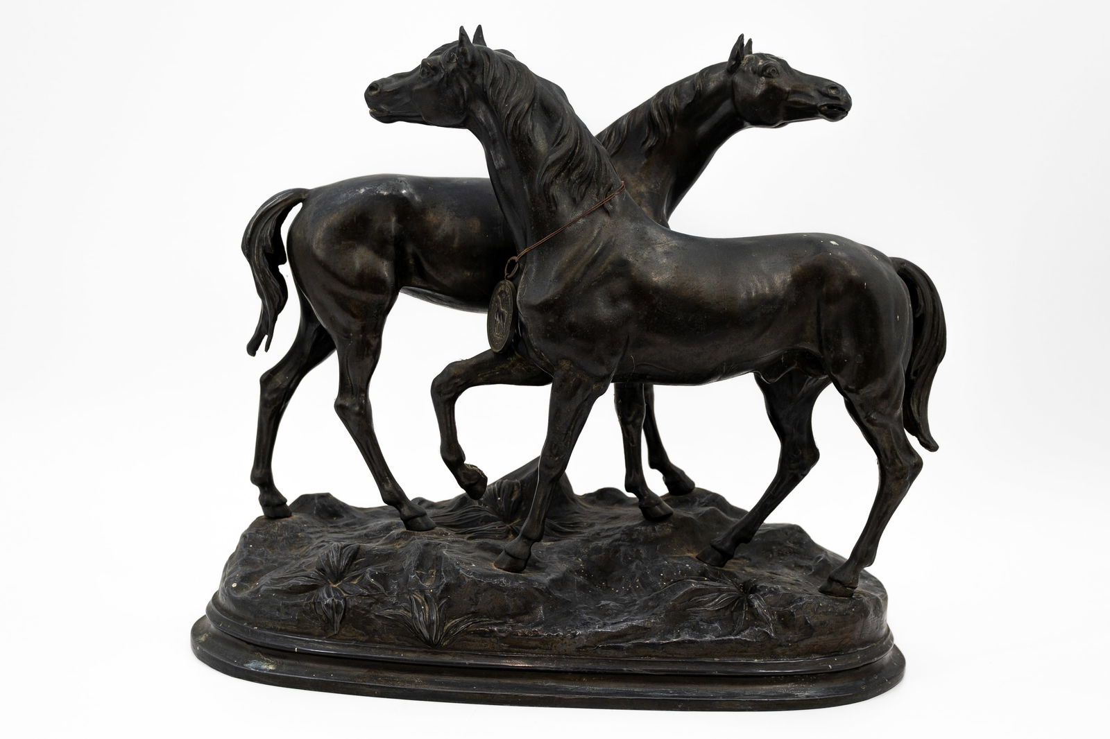 A large and antique patinated spelter sculpture of two standing horses (1 of 12)