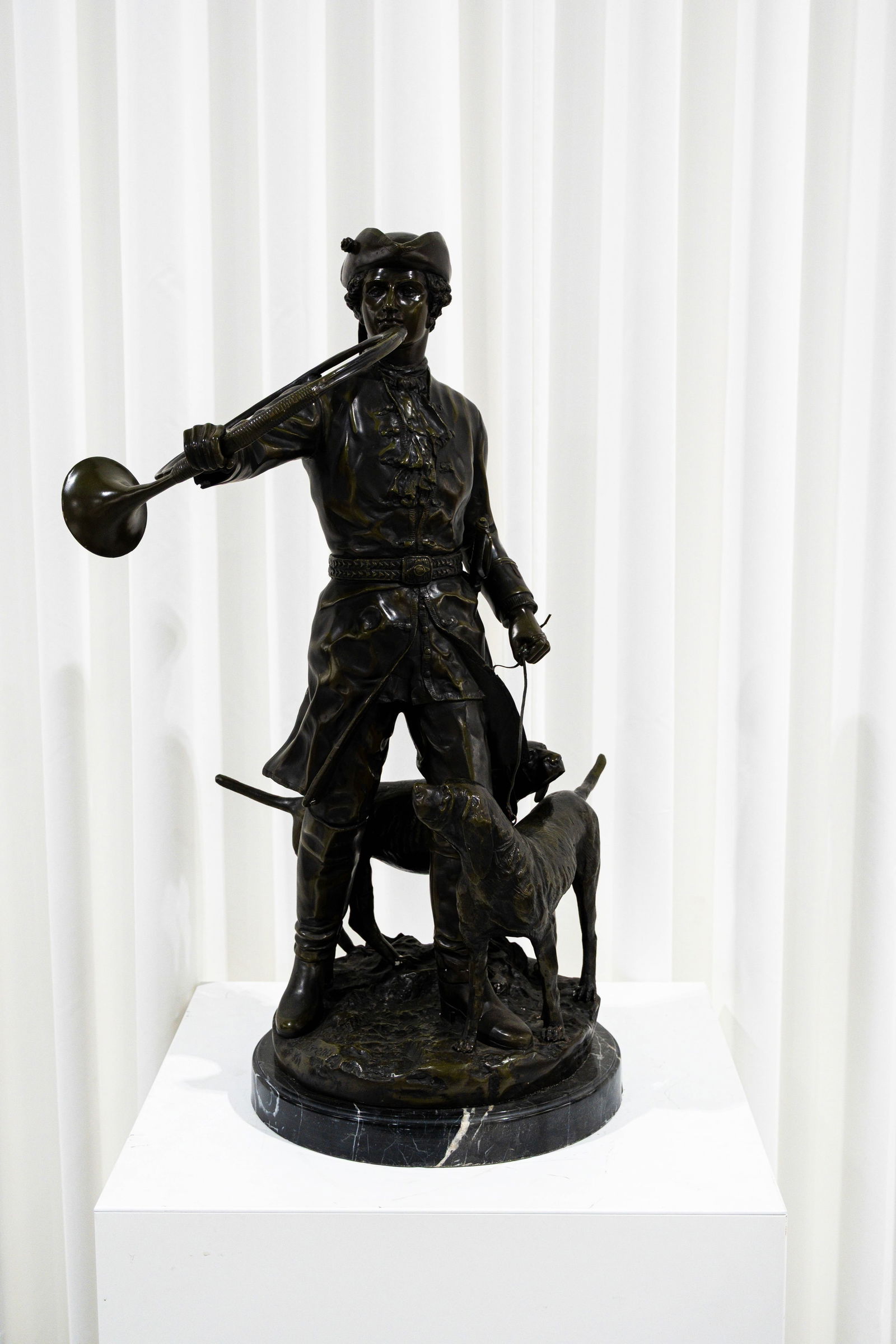 A large 20th century patinated bronze sculpture of a hunter and his dogs (1 of 11)
