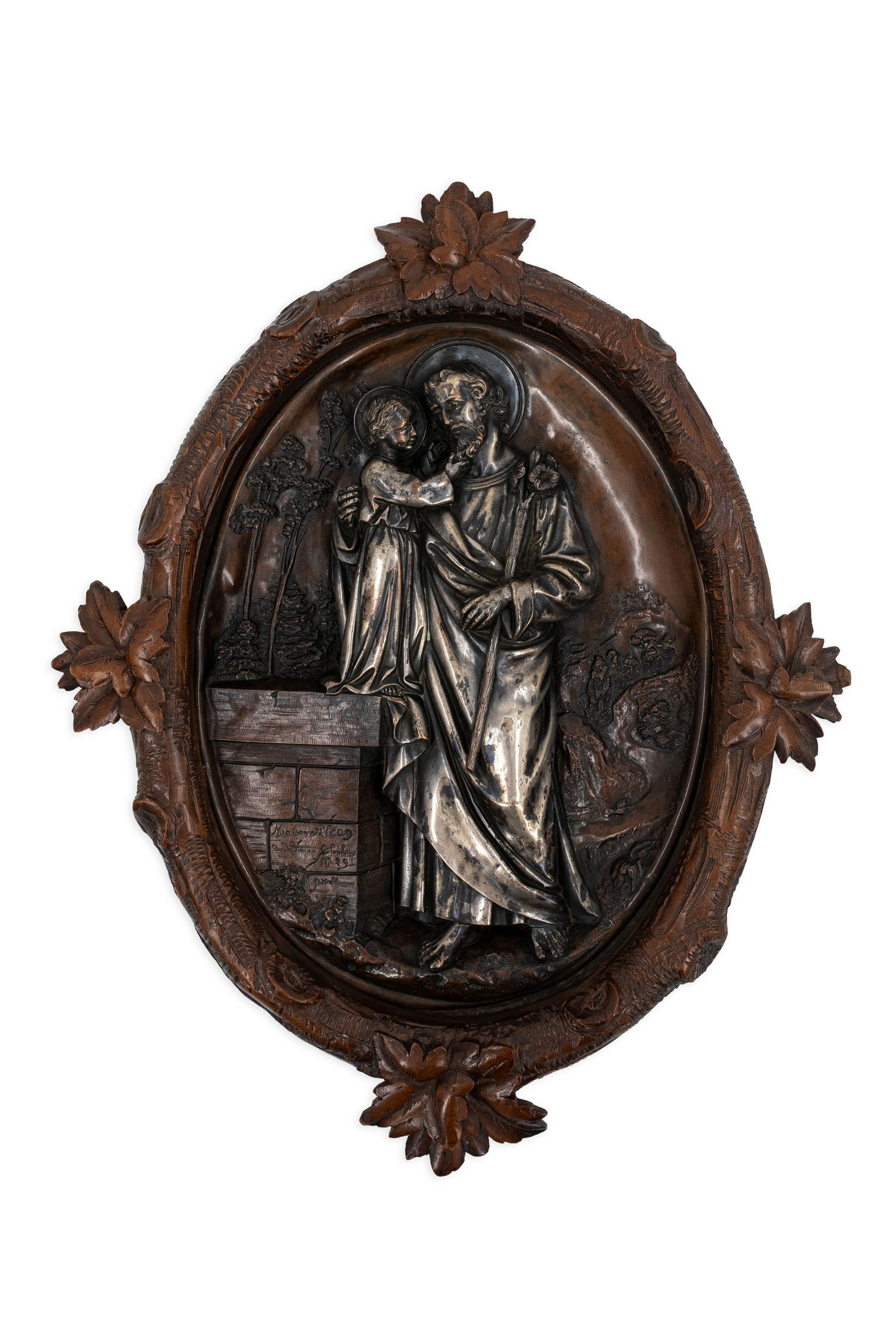 An antique religious oval silver plated brass bas-relief sculpture mounted in a carved wooden frame (1 of 6)