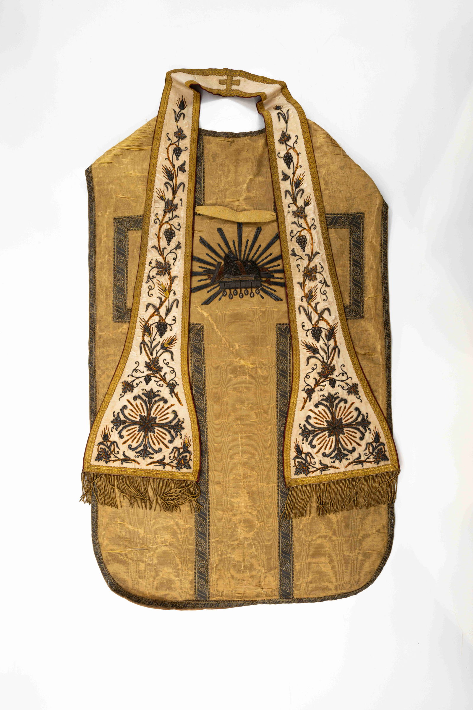 An antique and finely hand-embroidered religious decorated chasuble: An antique and finely hand-embroidered religious decorated chasuble. First half 20th century. L: 110 - W: 69 cm