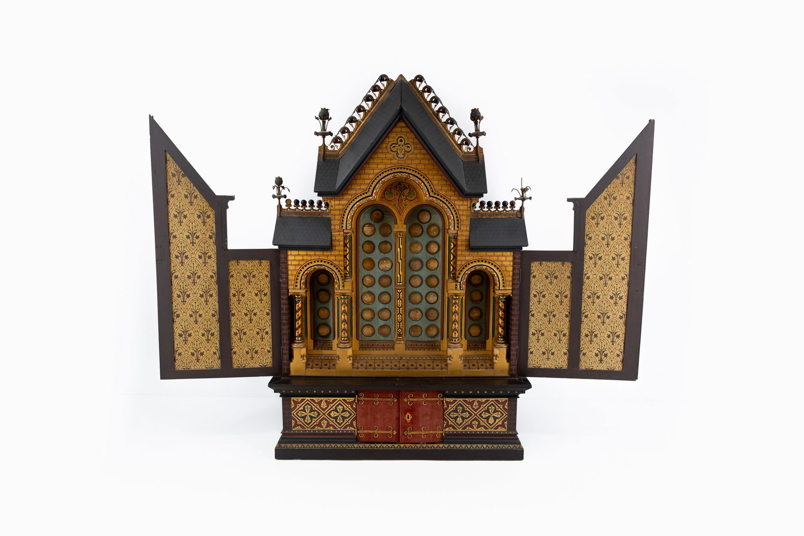 An imposing neo-gothic polychrome wood decorated altar cabinet mounted with 38 sealed theca relics: An imposing neo-gothic polychrome wood decorated relic altar cabinet with matching wall console, mounted with 38 various sealed thecas with relics of various Apostles, Saints, Blesseds and others. 