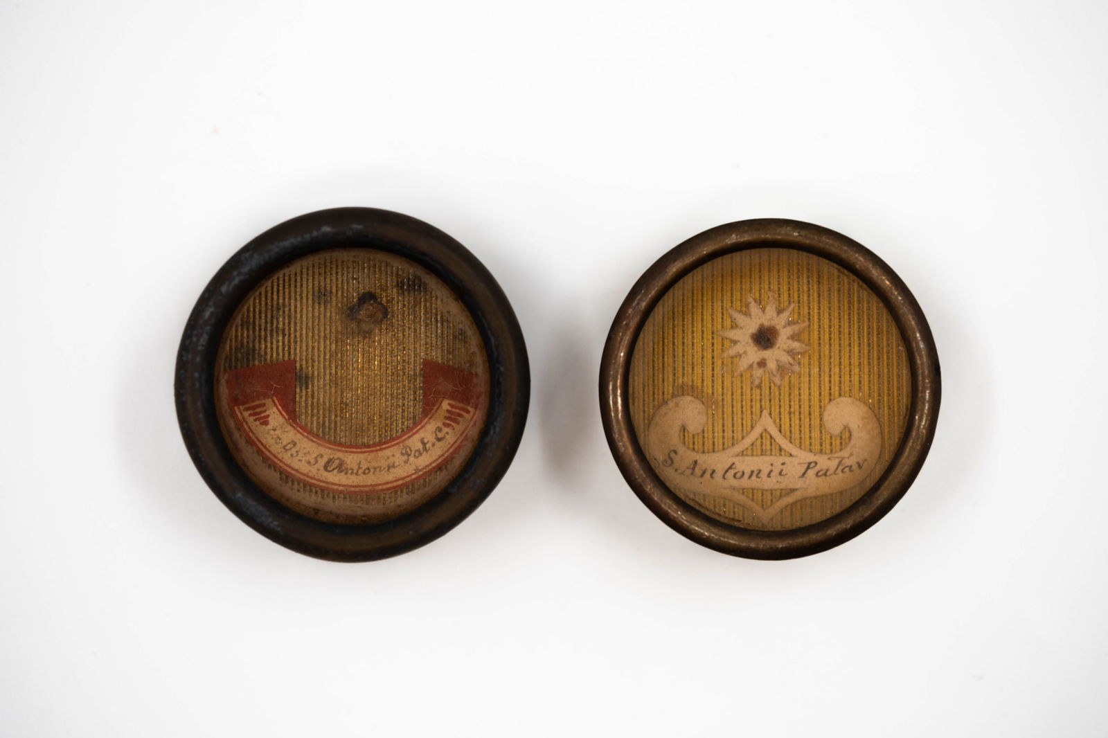 A lot of two sealed thecas containing relics of Saint Anthony, with a Certificate of Authenticity: A lot of two sealed thecas containing relics of Saint Anthony of Padua, Confessor, with a Certificate of Authenticity. S. Antonii Patav. C., Saint Anthony of Padua, Confessor The thecas and/or