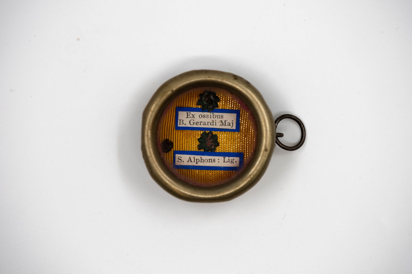 A sealed multitheca containing relics of Blessed Gerard Majella and Saint Alphonsus Liguori: A sealed multitheca containing relics of Blessed Gerard Majella and Saint Alphonsus Liguori, with a Certificate of Authenticity. B. Gerardi Maj., Blessed Gerard Majella S. Alphons Lig., Saint