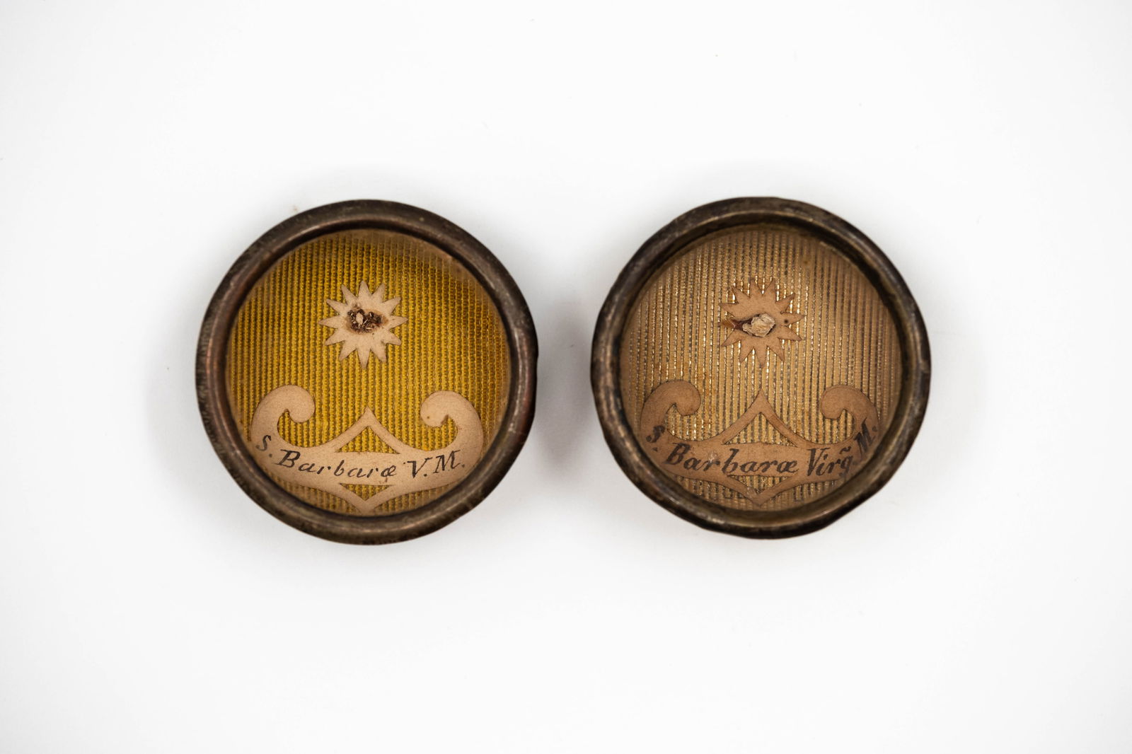 A lot of two sealed thecas containing relics of Saint Barbara, with a Certificate of Authenticity: A lot of two sealed thecas containing relics of Saint Barbara, with a Certificate of Authenticity. S. Barbarae VM., Saint Barbara, Virgin and Martyr S. Barbarae Virg. M., Saint Barbara, Virgin