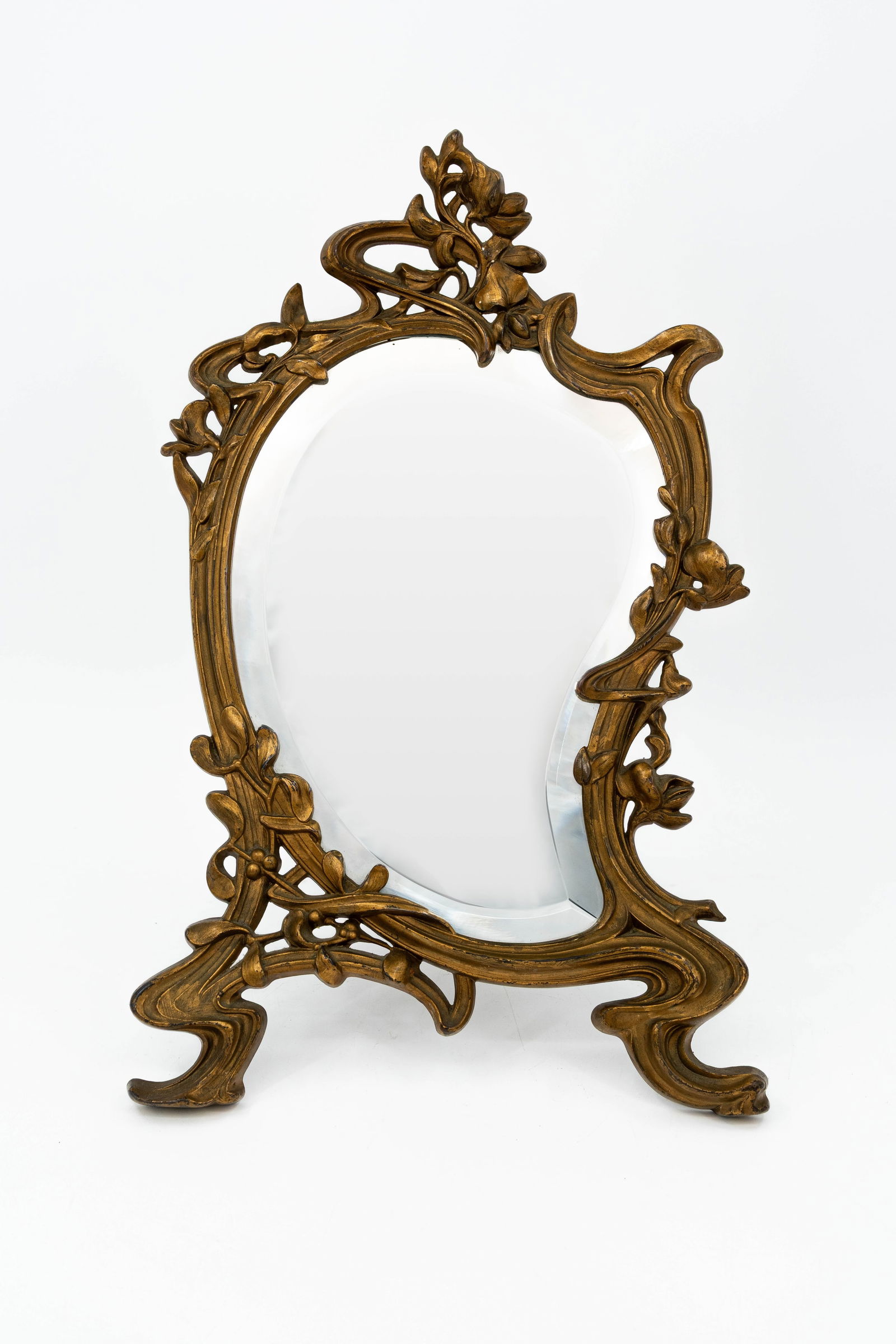 An Art nouveau decorated patinated brass vanity table mirror (1 of 11)