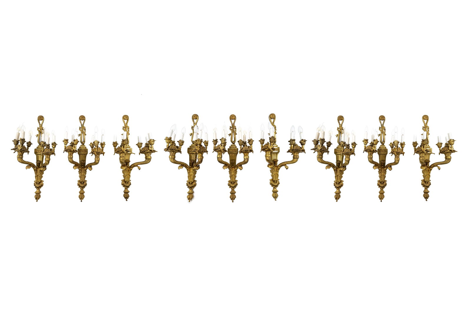 A lot of six large 20th century Louis XVI style gilt bronze wall light appliques: A lot of six large 20th century Louis XVI style gilt bronze wall light appliques. Circa 1970s. H: 90 - W: 36 cm