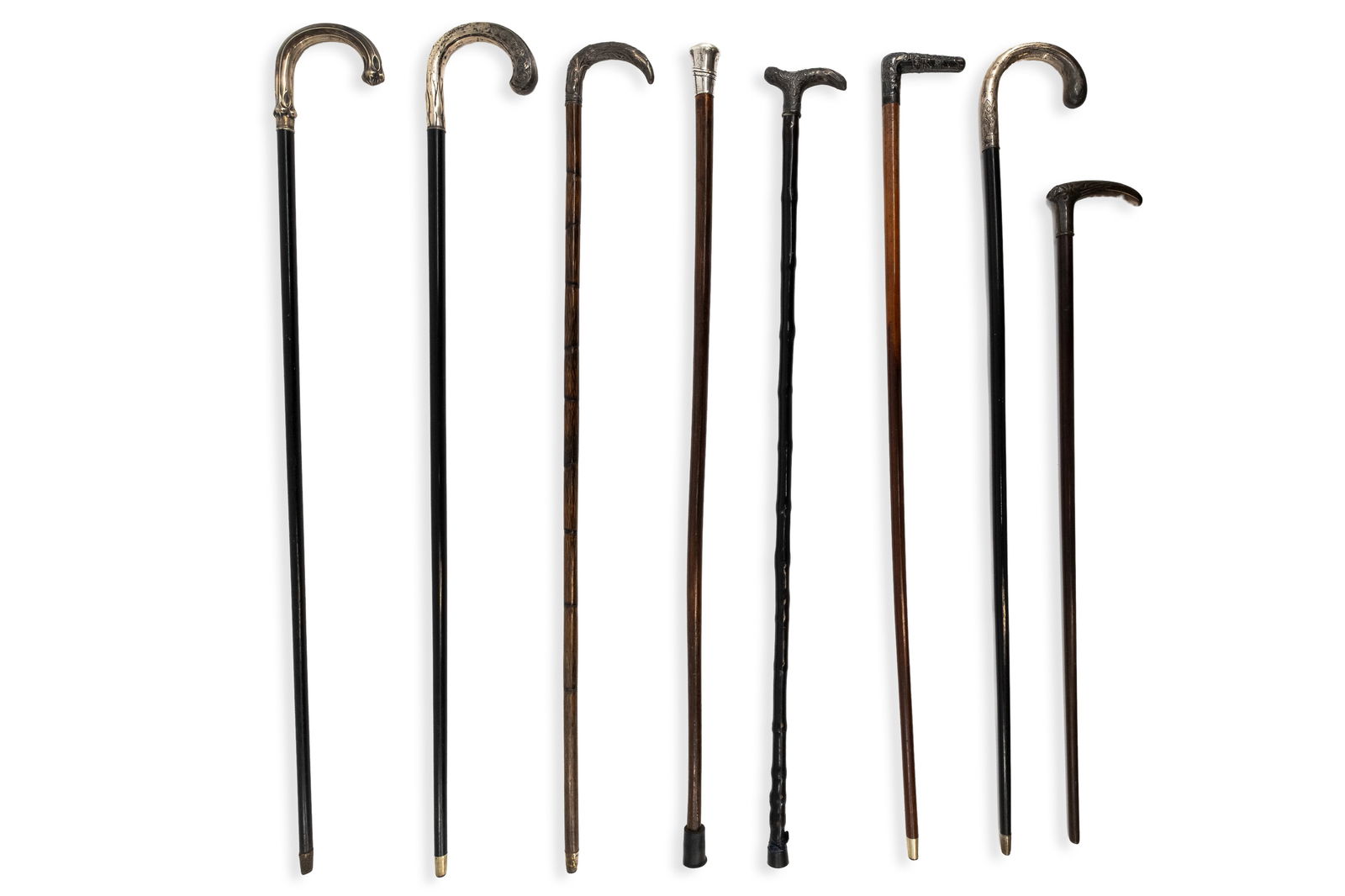 A collection of eight antique silver and silver plated variously decorated walking sticks.: A collection of eight antique silver and silver plated variously decorated walking sticks. Six walking sticks stamped 800 ( silver) two sticks are silverplated. Hallmarks, 19th/20th century. 