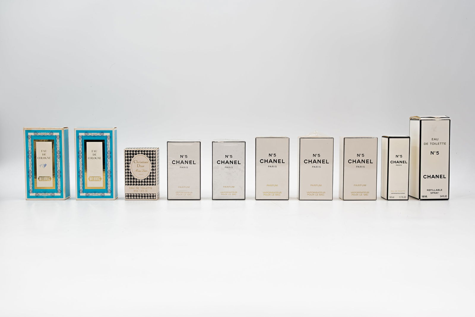 A collection of ten French vintage perfume bottles in their original boxes (1 of 9)