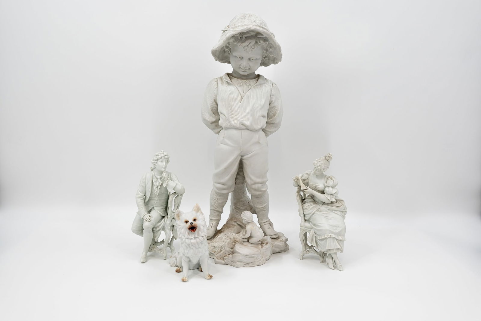 A composed lot of four various antique white bisquit figures: A composed lot of four various antique white bisquit figures. Circa 1900. Condition: small damages, report available on request. H: 13,5 - 47,5 cm, smallest to largest