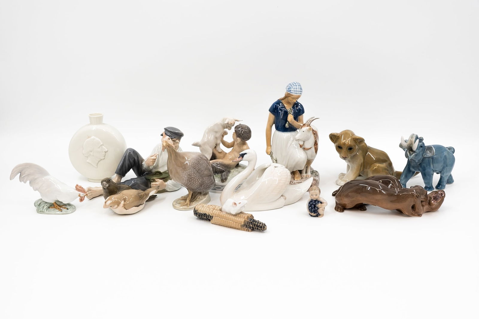 A collection of 13 Royal Copenhagen variously decorated porcelain figurines (1 of 20)
