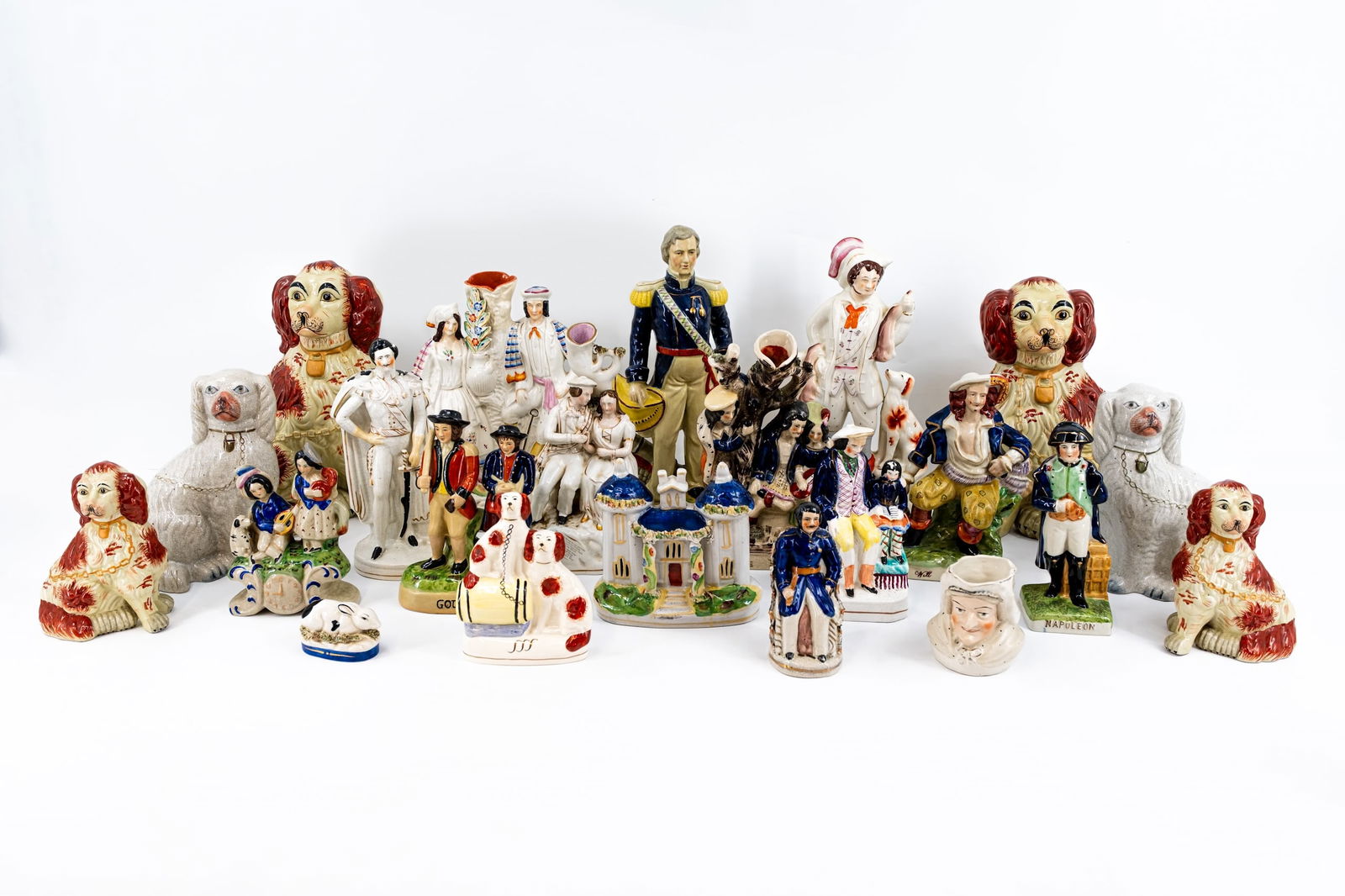 A large 20th century collection of 22 English Staffordshire style variously decorated and shaped (1 of 19)