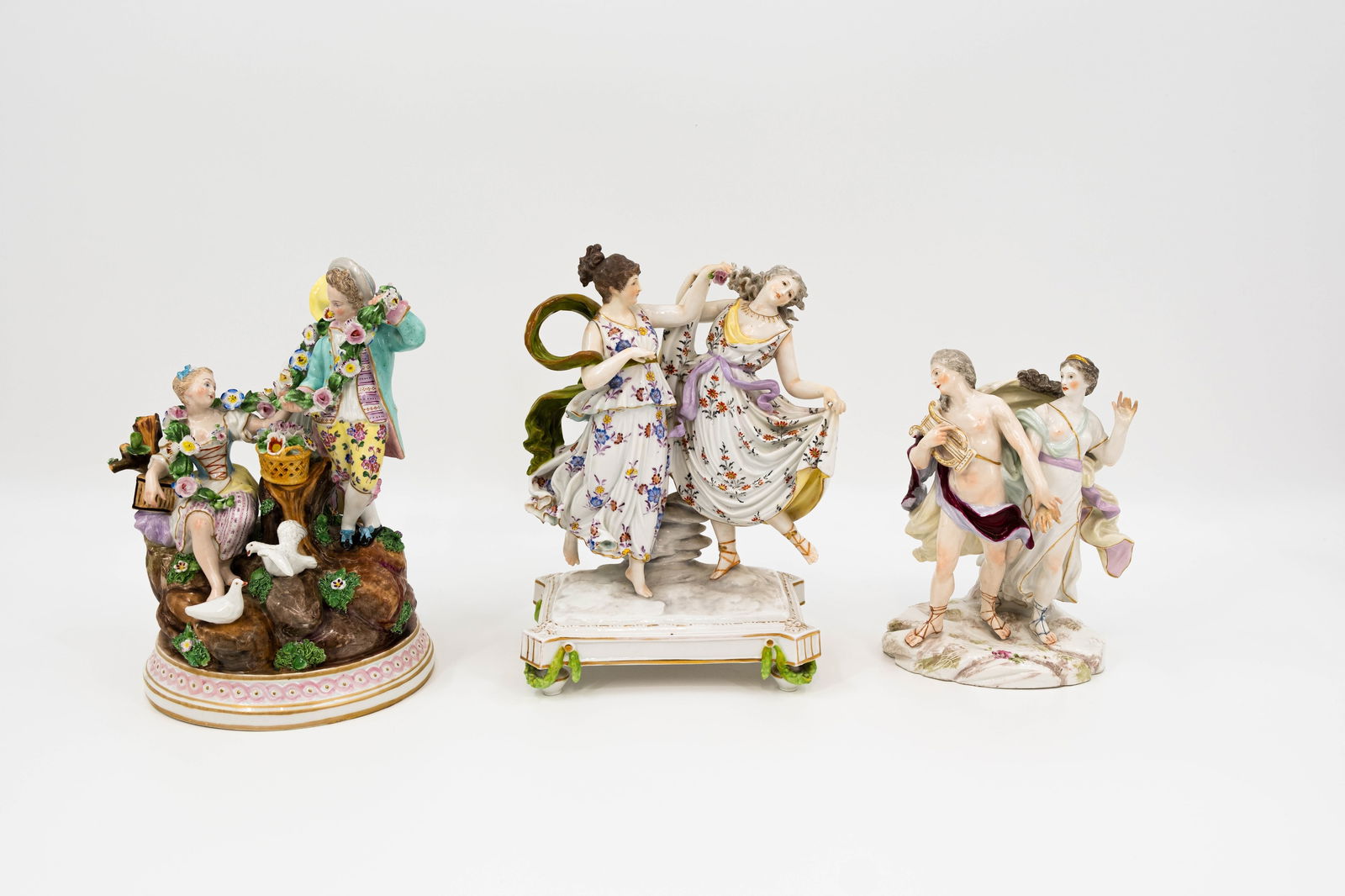 A lot of three Saxony style decorated porcelain figural groups (1 of 20)