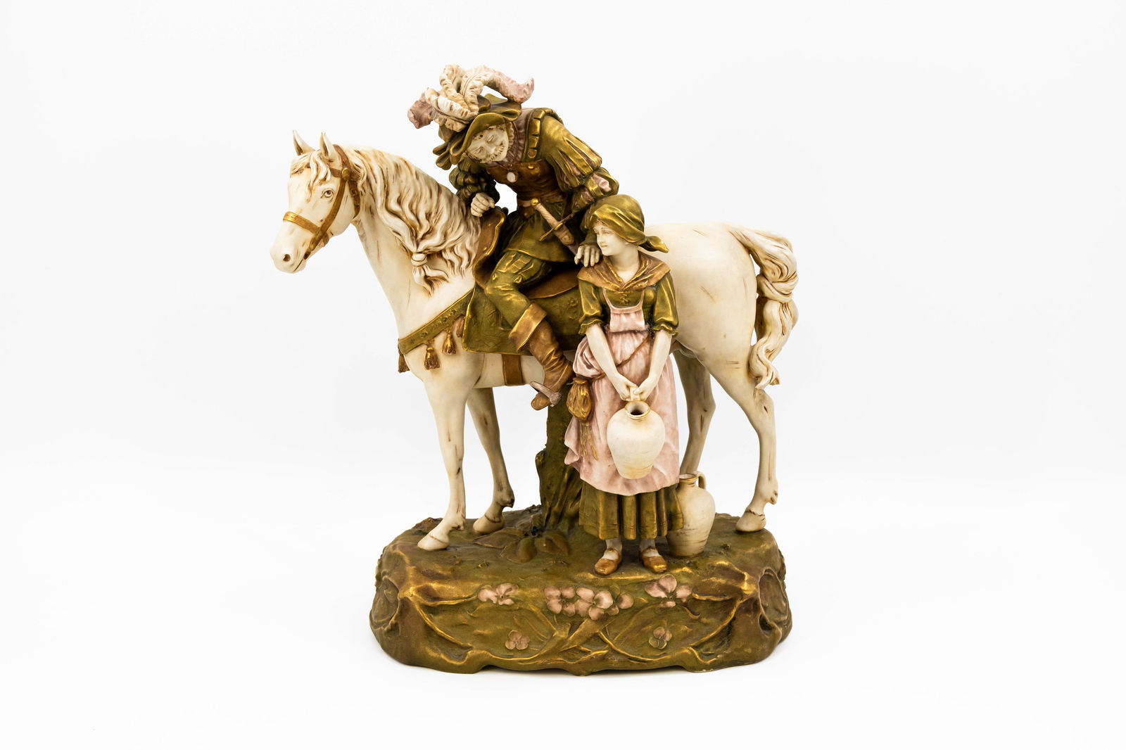 A Bohemian decorated porcelain figural group by Royal Dux: A Bohemian decorated porcelain figural group by Royal Dux, depicting a lady and a musketeer on horseback. Marked and numbered. 19th/20th century. H: 40 cm