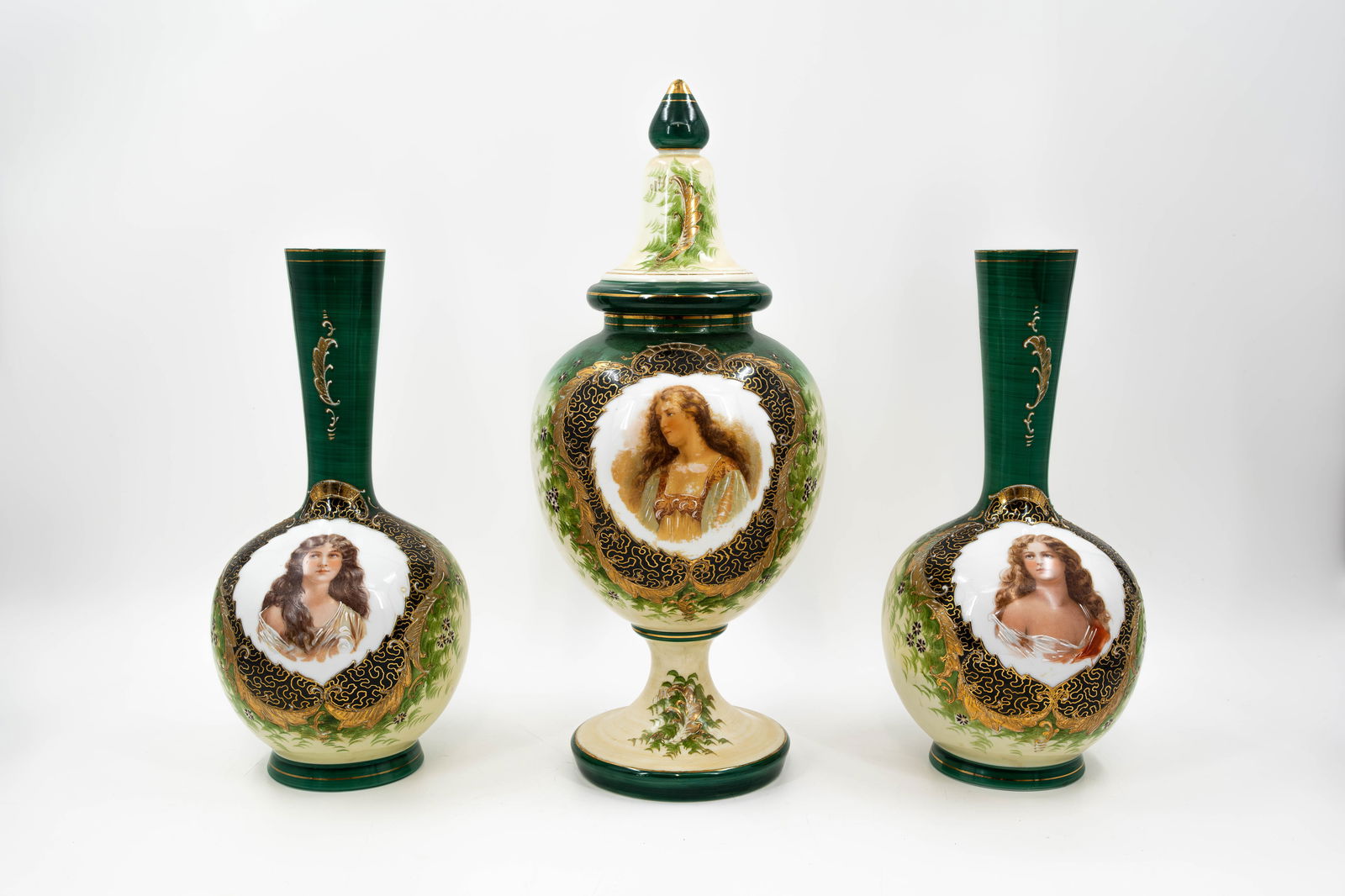 A matching set of antique opaline glass vases decorated with portraits: A matching set of antique opaline glass vases decorated with portraits. Circa 1900. H: 36,5 - 47 cm