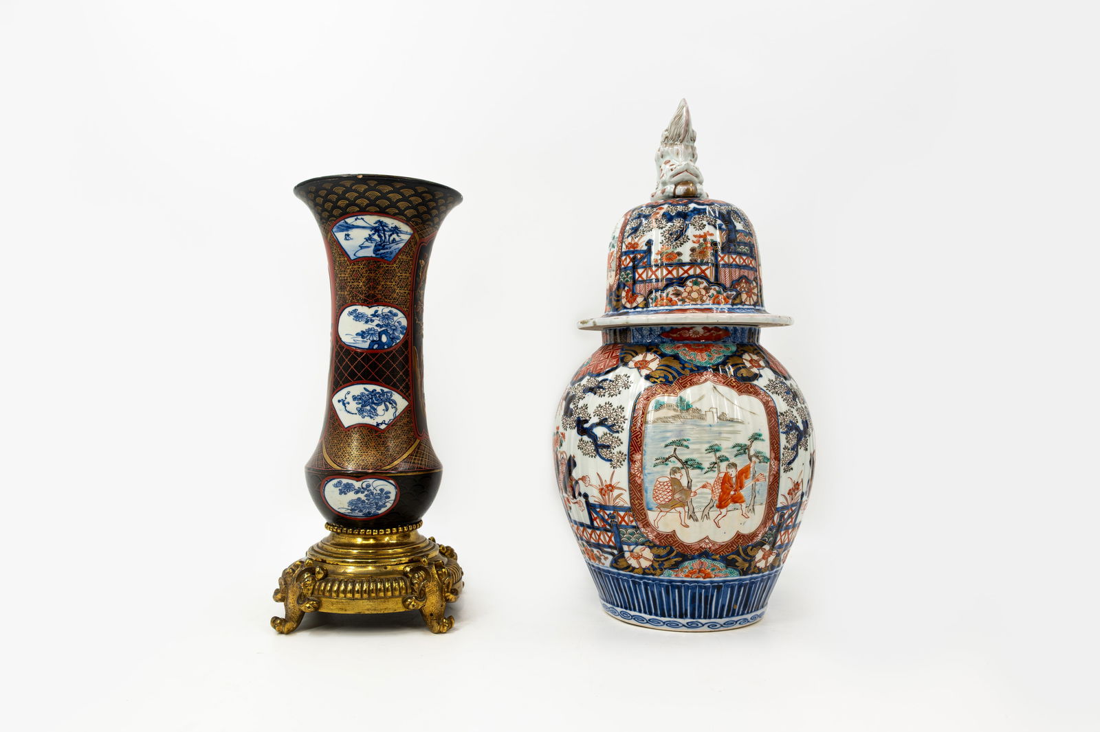 A lot of two antique Japanese blue and imari style various decorated porcelain vases: A lot of two antique Japanese blue and imari style bronze mounted and covered various decorated porcelain vases. Circa 1900.