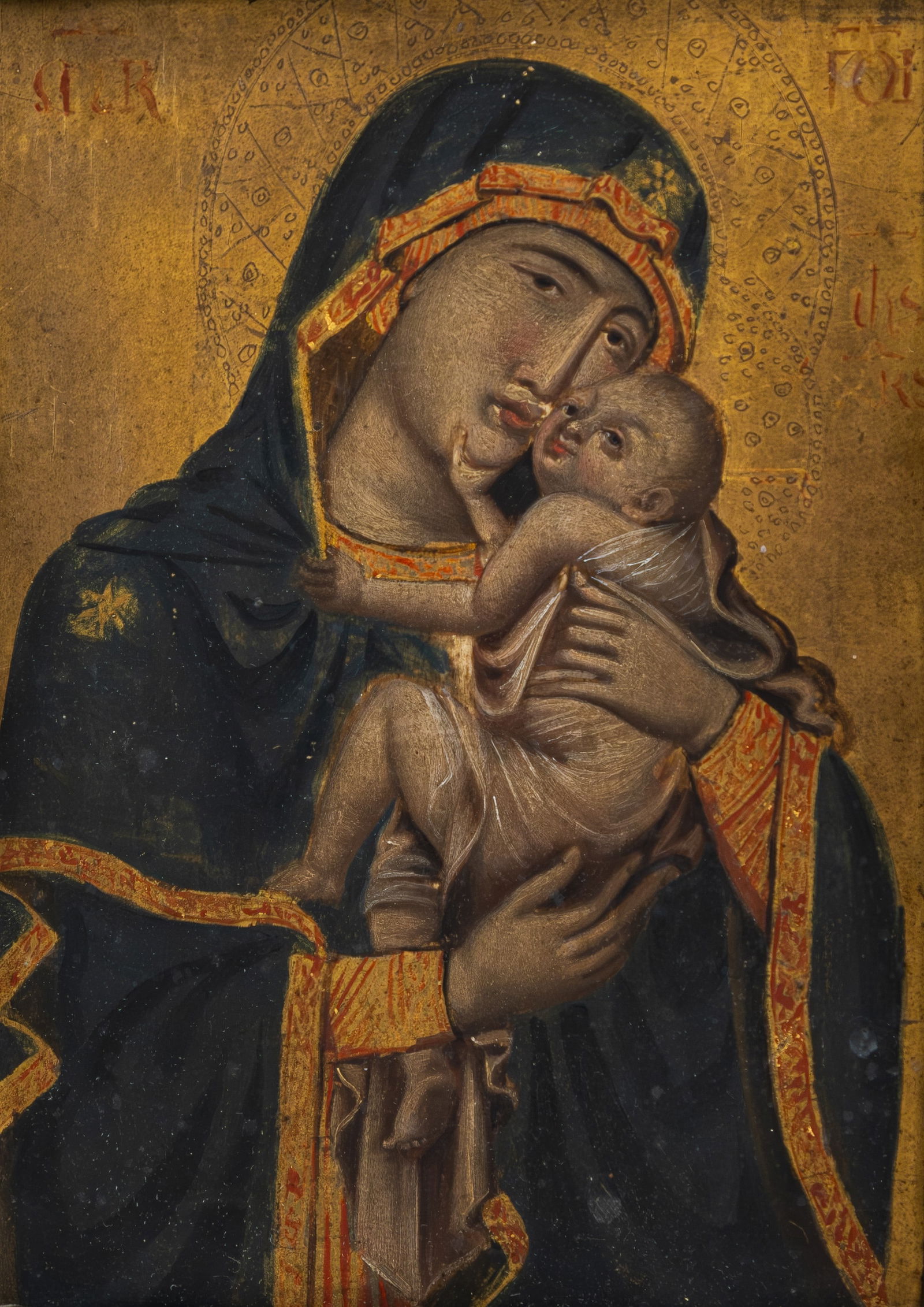 An antique oil on panel religious painting representing mother and child: An antique oil on panel religious painting representing mother and child. Mounted in a polychrome richly decorated wooden frame. 18th/19th century. H: 18,5 - W: 14 cm