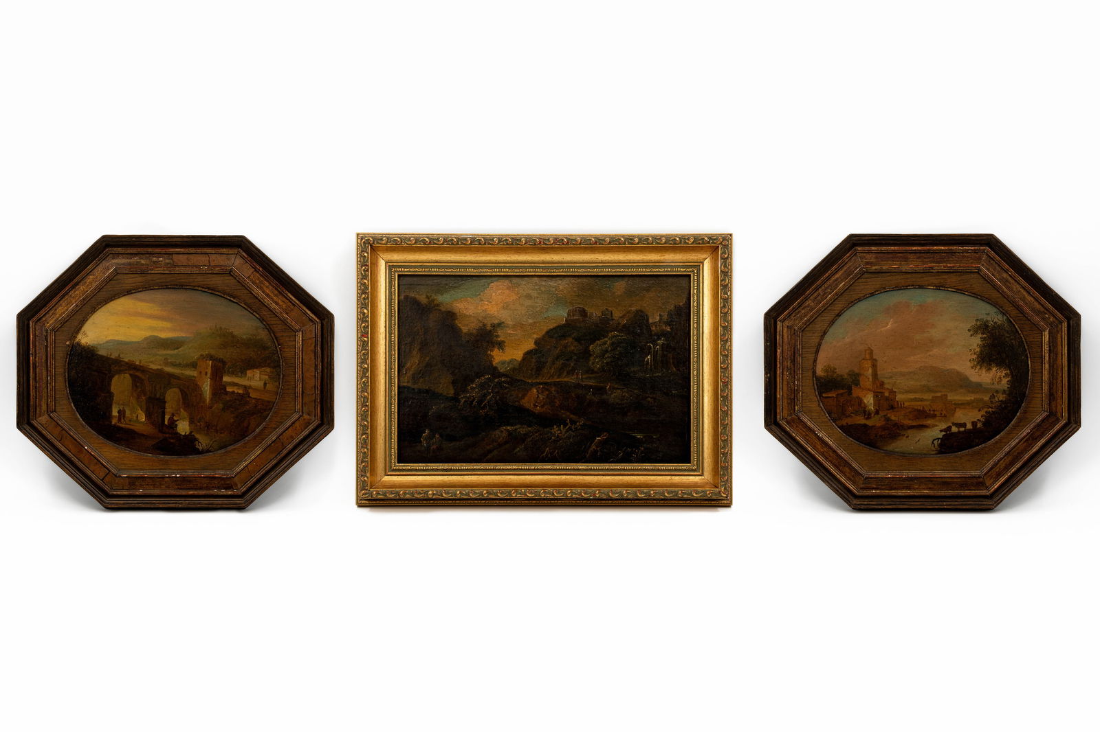 A lot of three antique oil on panel paintings representing river and mountain scenes: A lot of three antique oil on panel paintings representing river and mountain scenes. Unsigned, 18th/19th century. H: 21 - W: 32 cm H: 22,5 - W: 28,5 cm