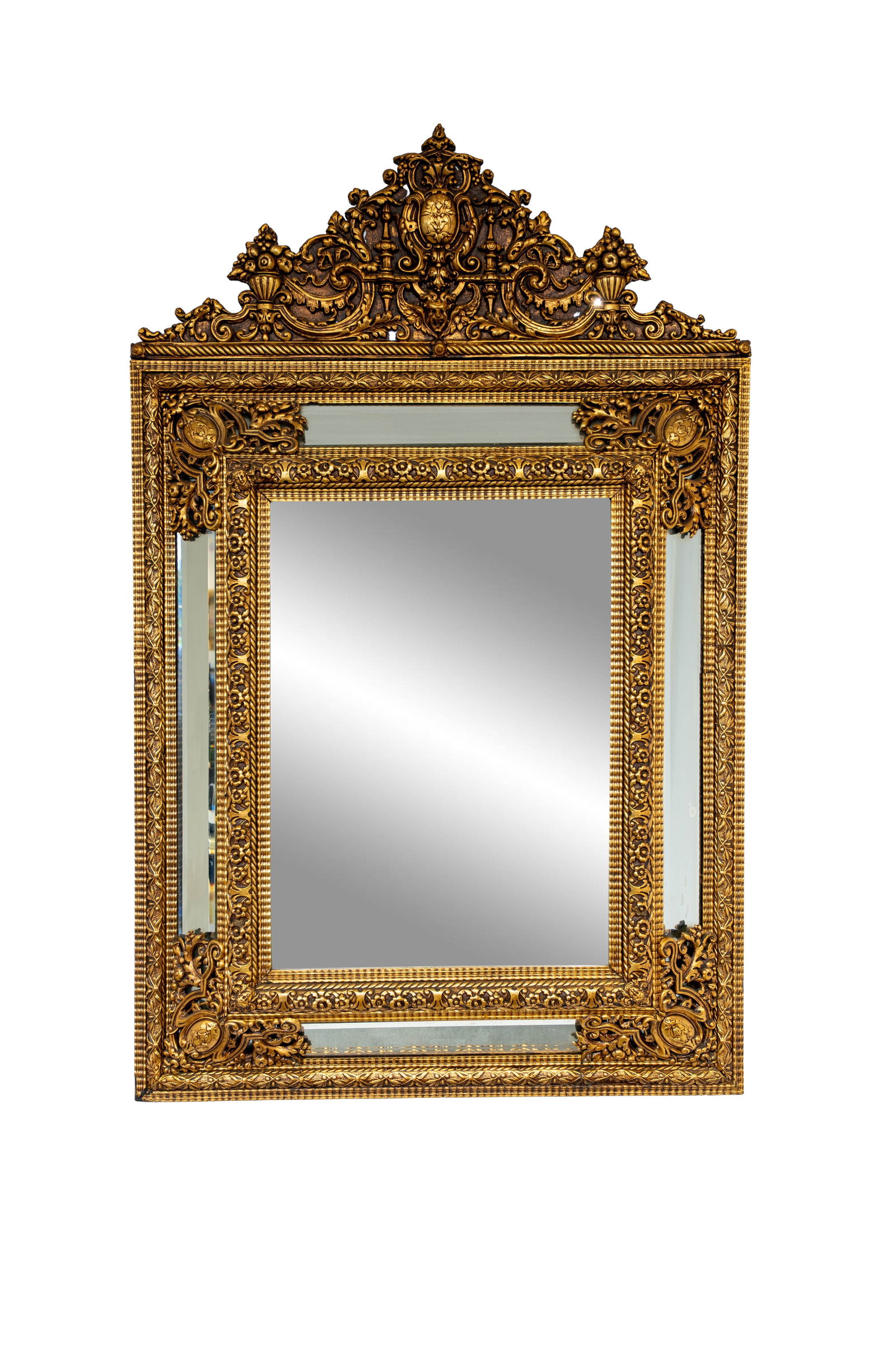 A large and antique baroque style patinated brass repoussé decorated mirror (1 of 5)