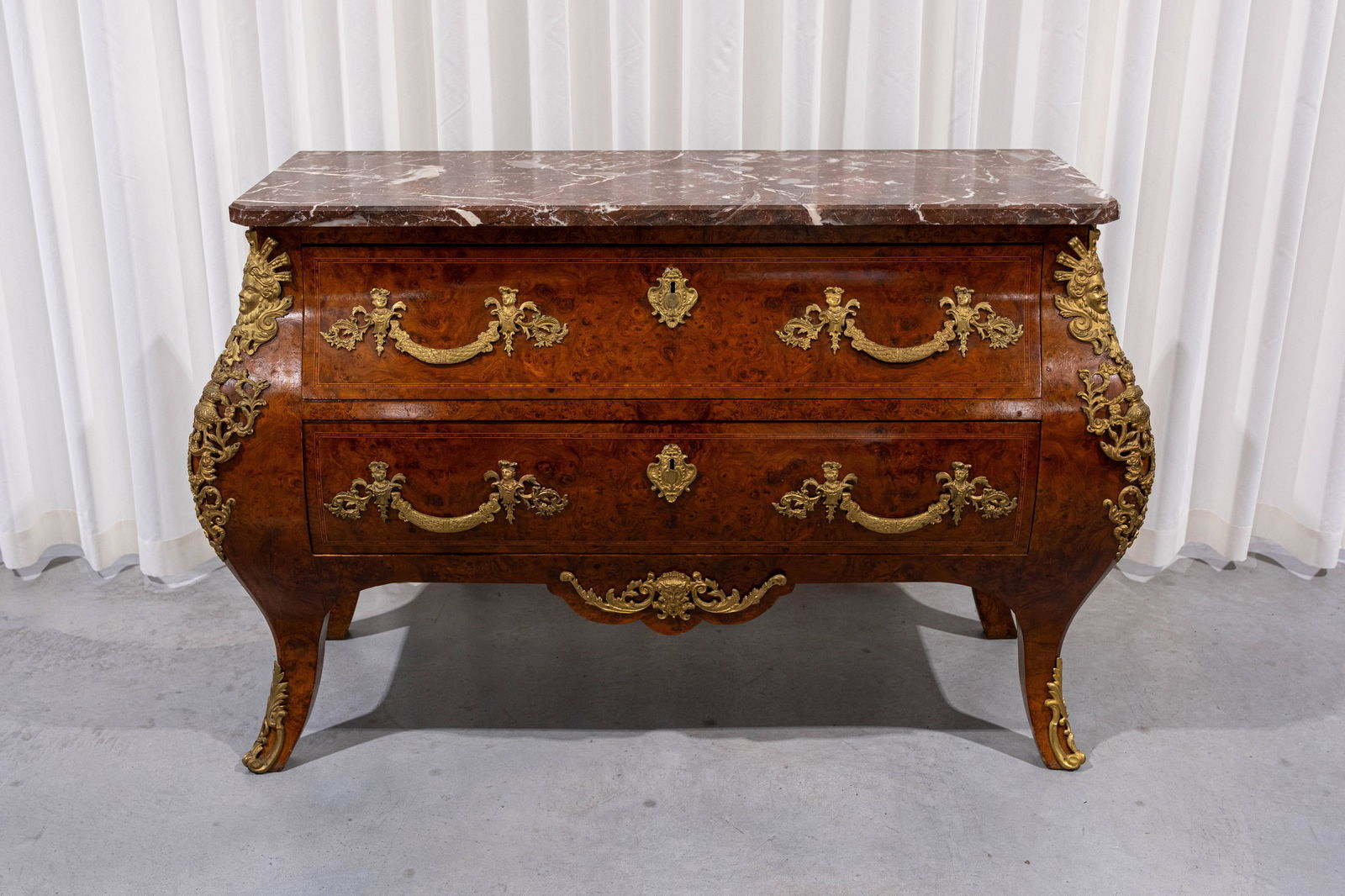 A Louis XV style commode with gilt brass mounts and a red marble top (1 of 7)